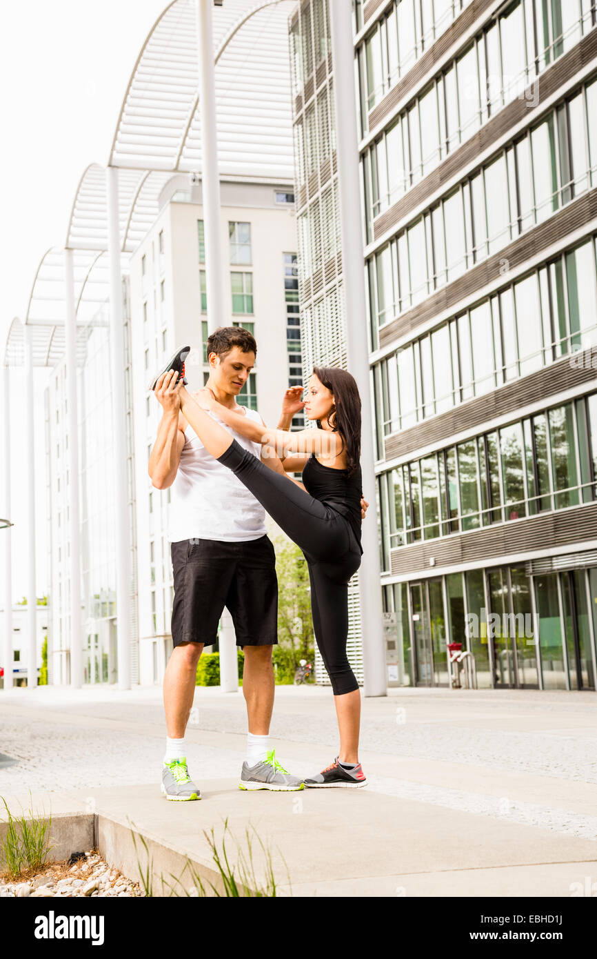 Personal trainers doing outdoor training in urban place, Munich, Bavaria, Germany Stock Photo