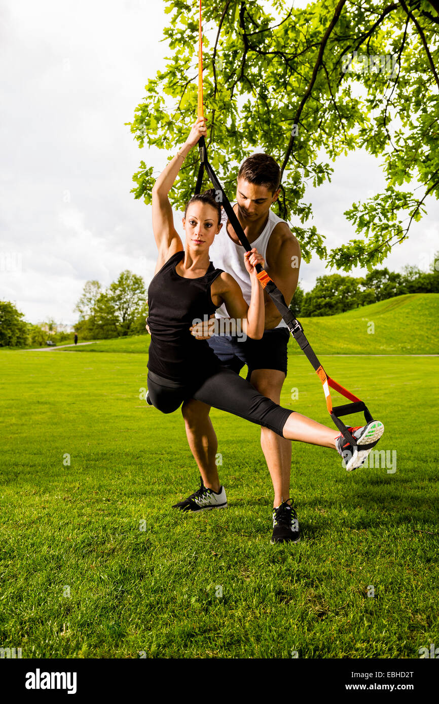 Personal trainers doing outdoor training in urban place, Munich, Bavaria, Germany Stock Photo