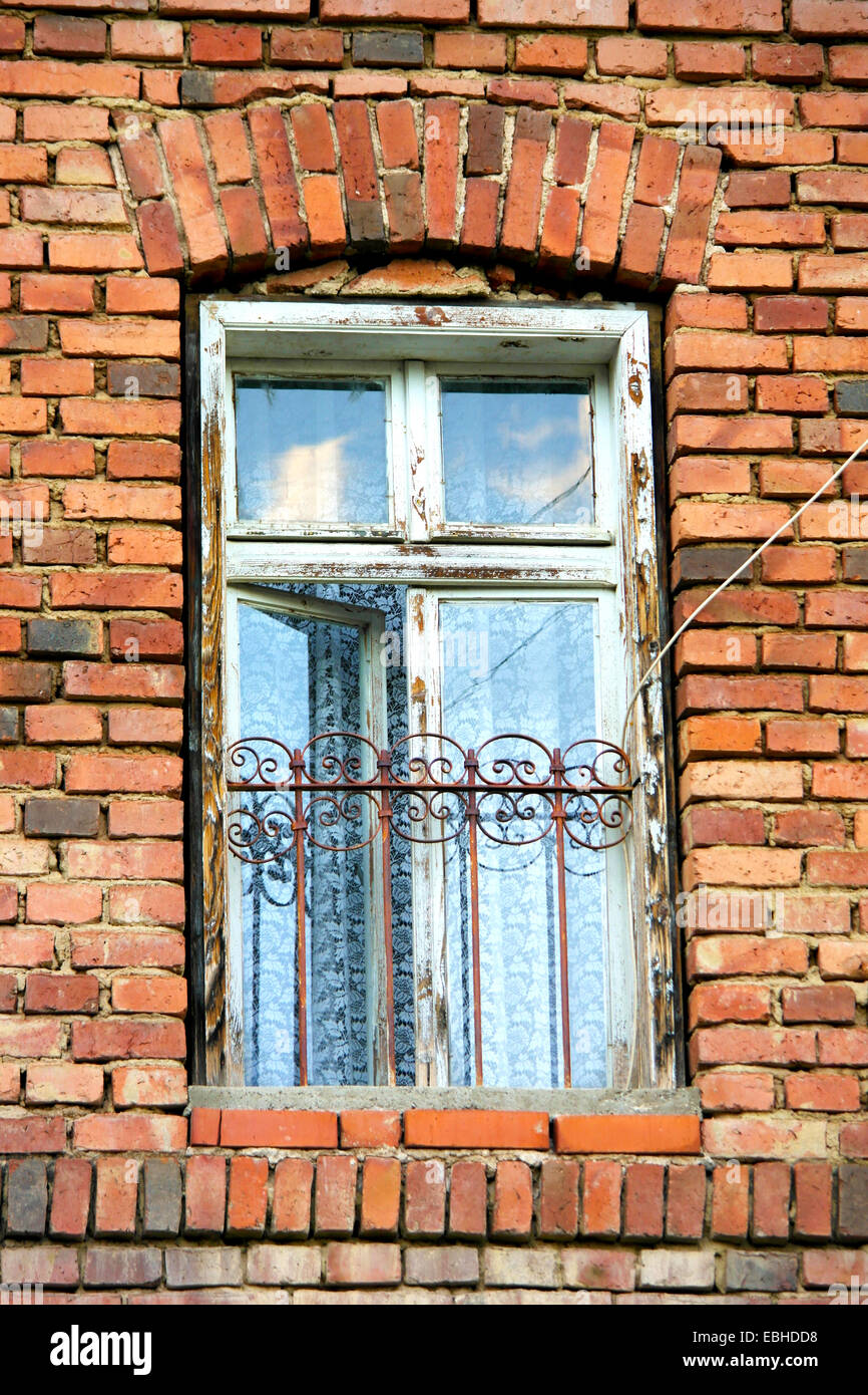 Old open window in European brick house Stock Photo