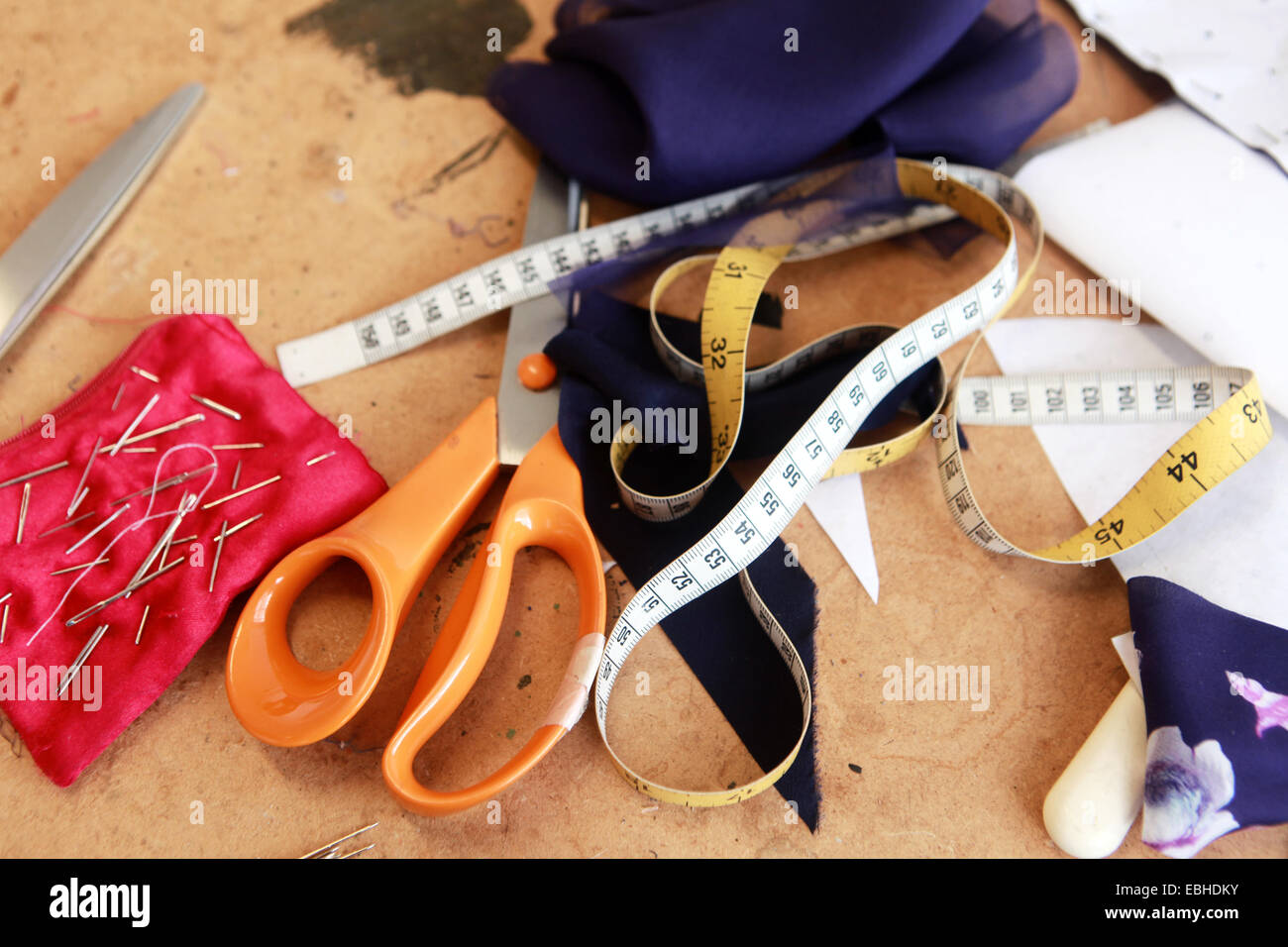 Sewing accessories; scissors, measuring tape, pins, needles, fabric