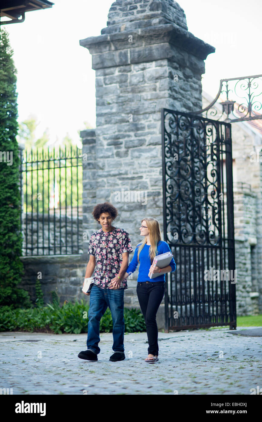 Students holding hands Stock Photo - Alamy