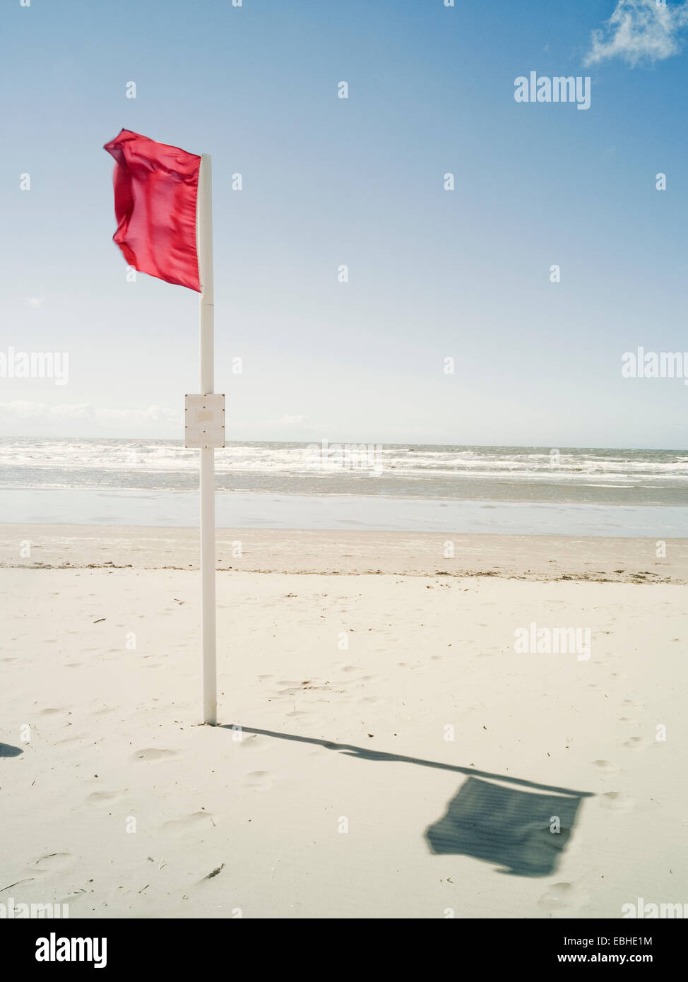 Red danger flag, Formby, England Stock Photo