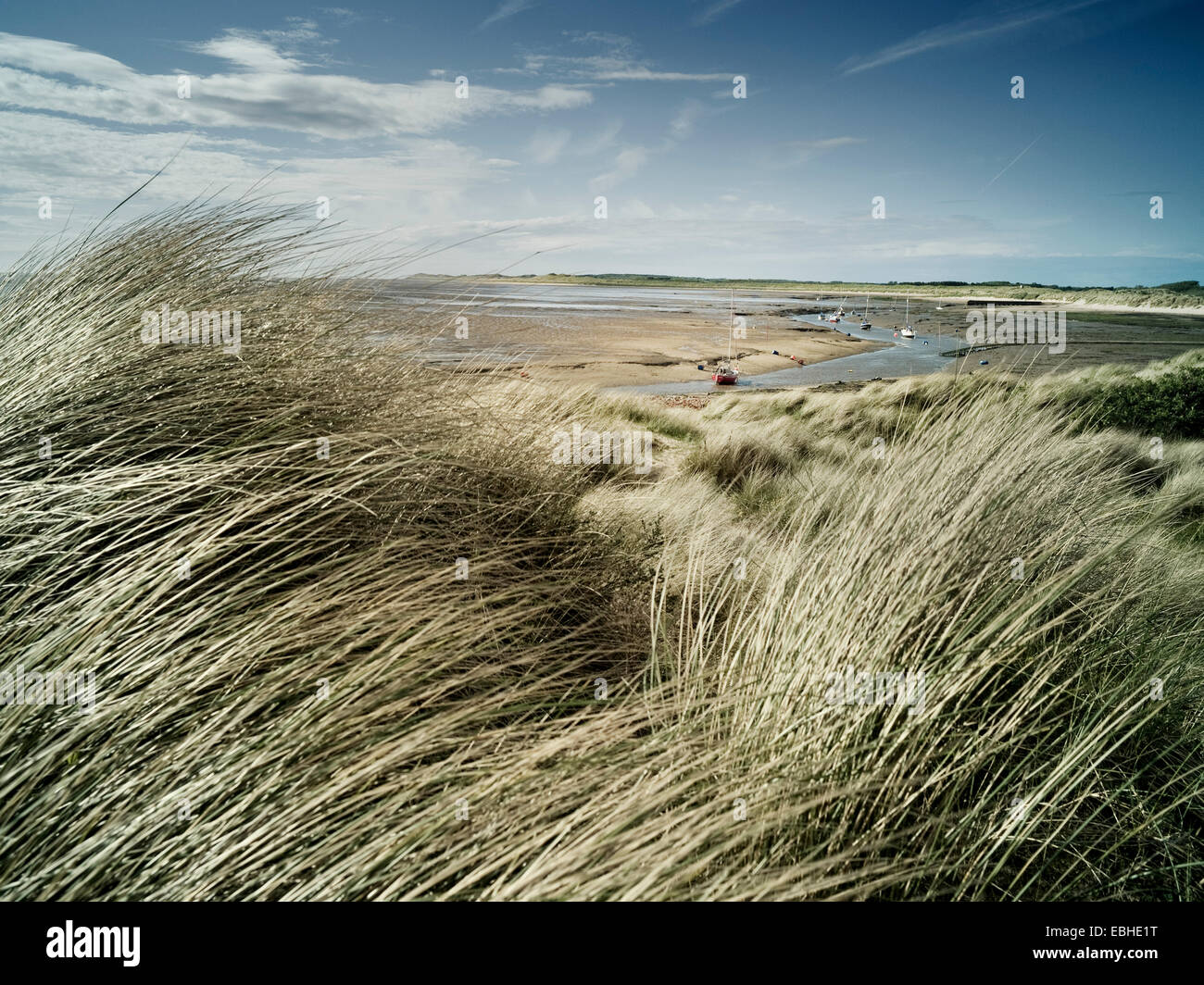 Dune grass and boats, Formby, England Stock Photo