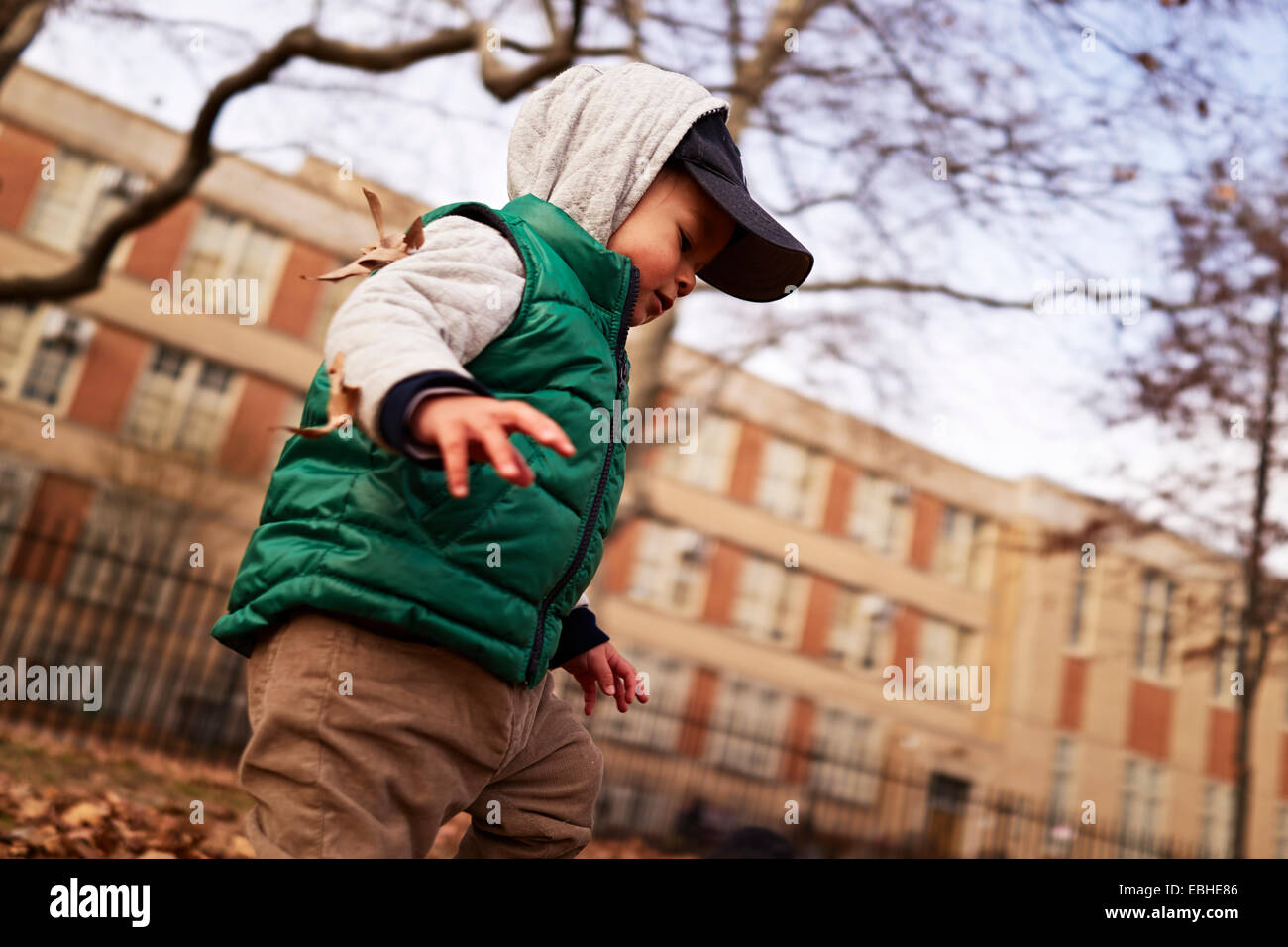 Boy playing in park, Brooklyn, New York, USA Stock Photo