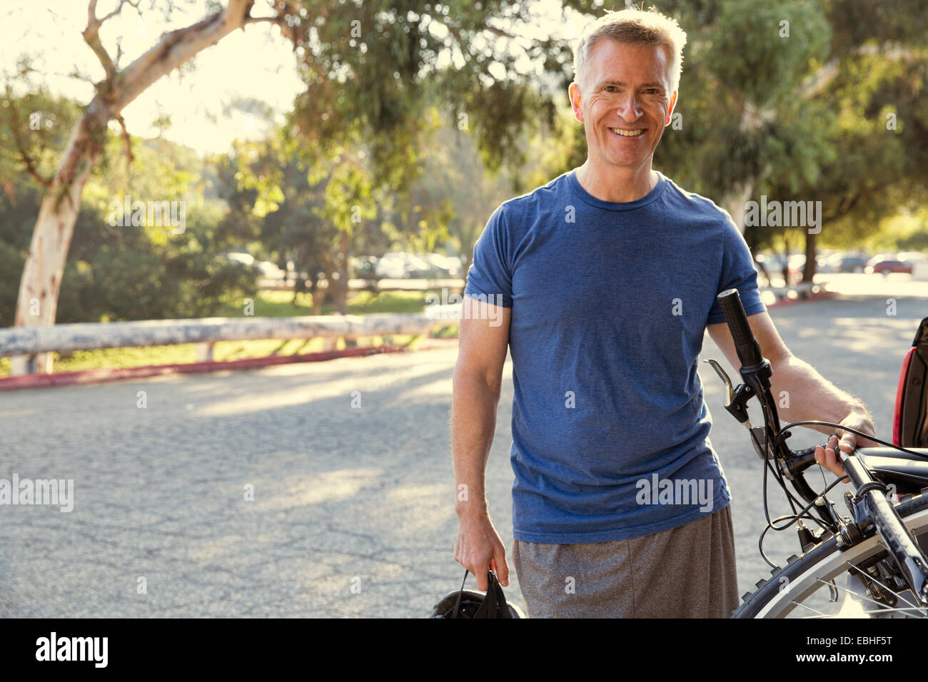 Portrait of mature male cyclist in park Stock Photo