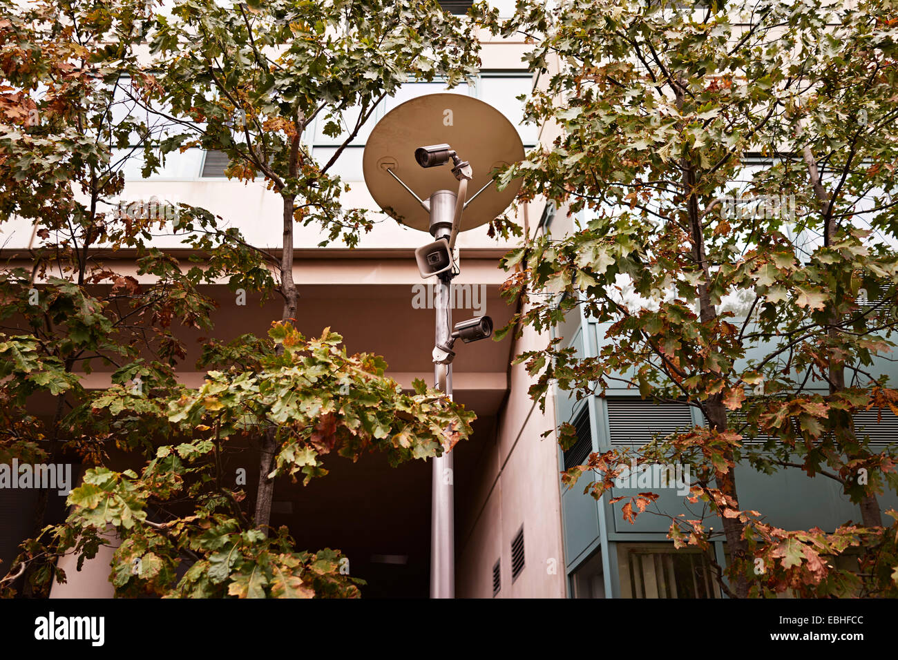 Low angle view of surveillance cameras on street light, Brooklyn, New
