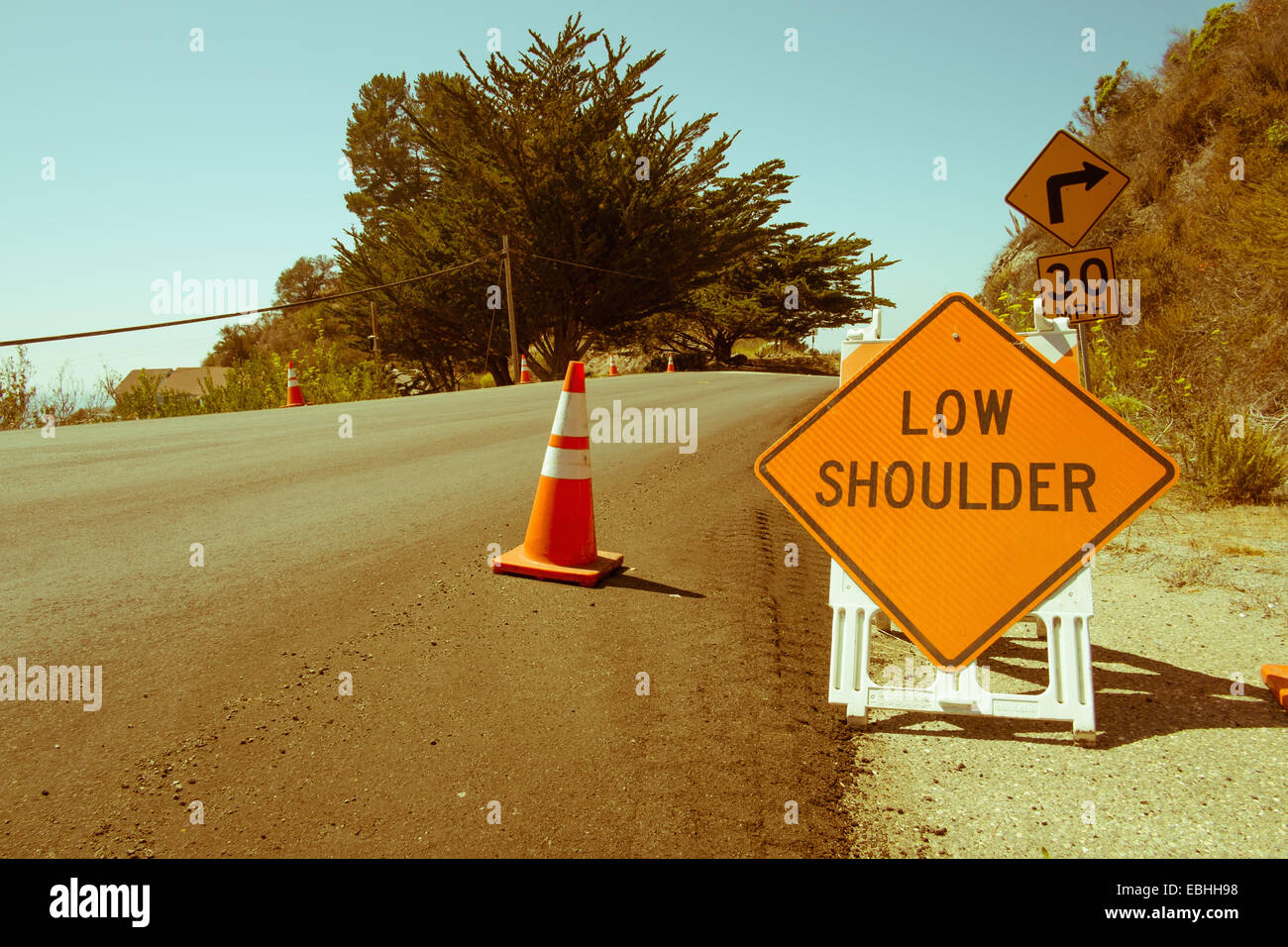 Yellow warning sign, highway 1, Big Sur, California, USA Stock Photo