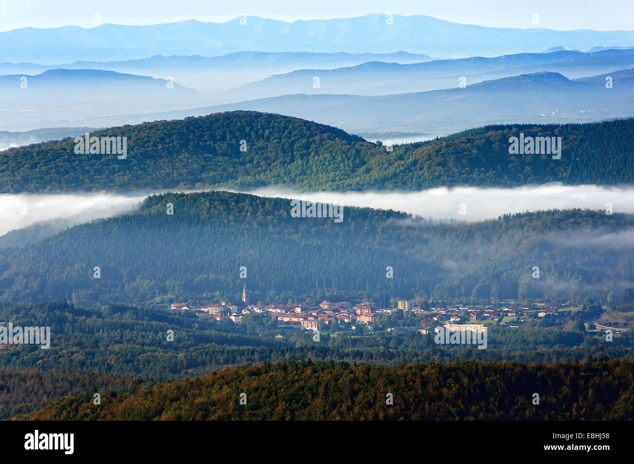 Otxandio village surrounding by foggy mountains. Basque country Stock Photo