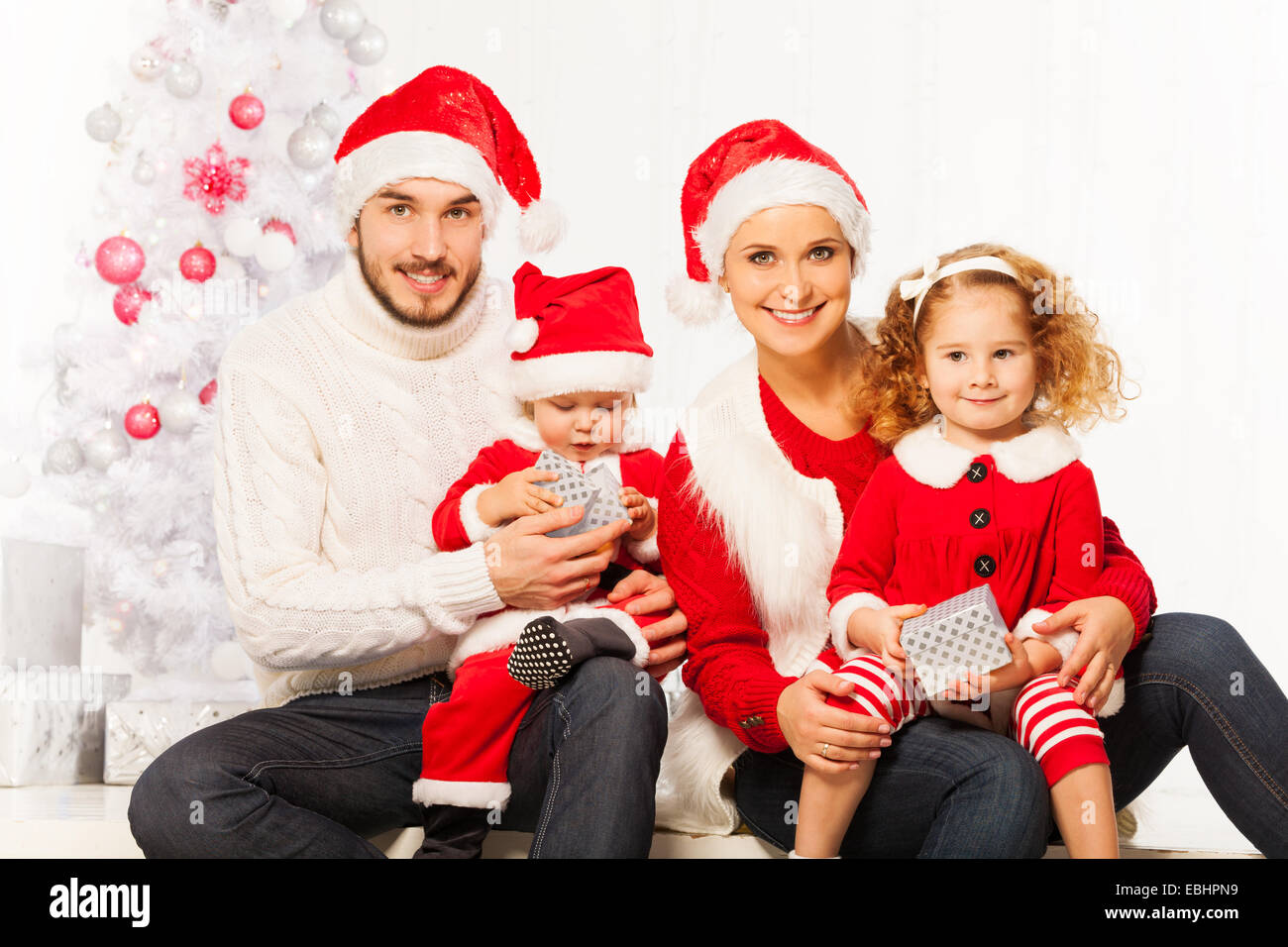 Happy young family with two children on Christmas Stock Photo