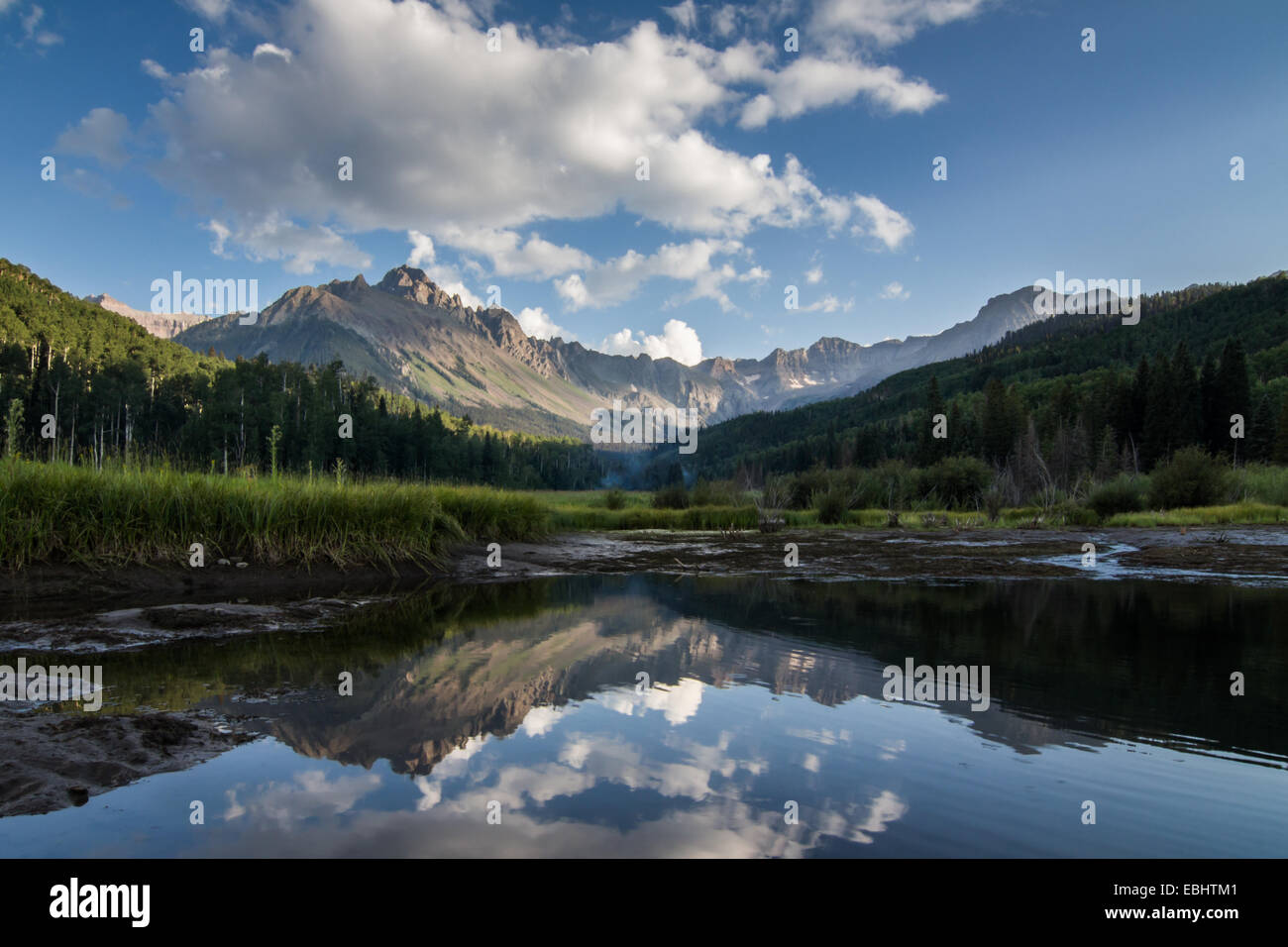 Majestic San Juan Mountains beautifully reflected in a pond in the Colorado Rockies Stock Photo