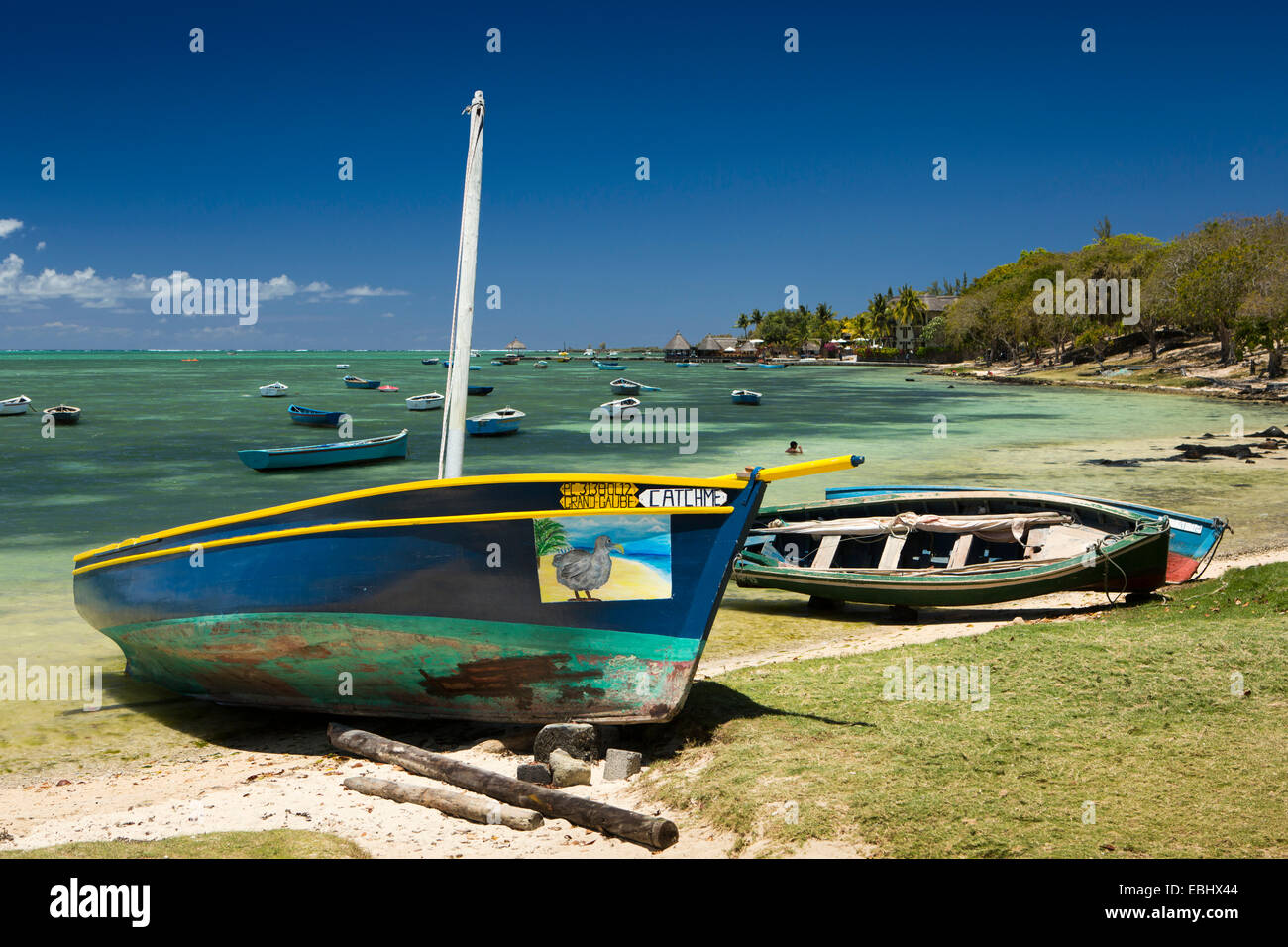 Mauritius, Grand Gaube public beach, crudely painted dodo on catch me beached boat prow Stock Photo