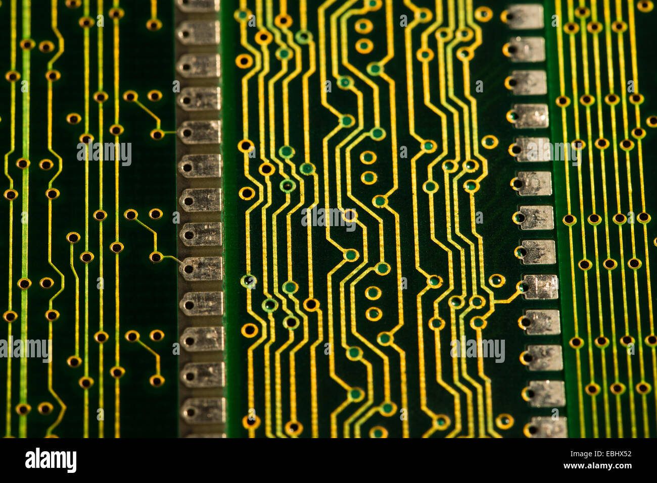 Electrical component parts of printed circuit boards at a macro level RAM surface mount technology golden printed conducting Stock Photo
