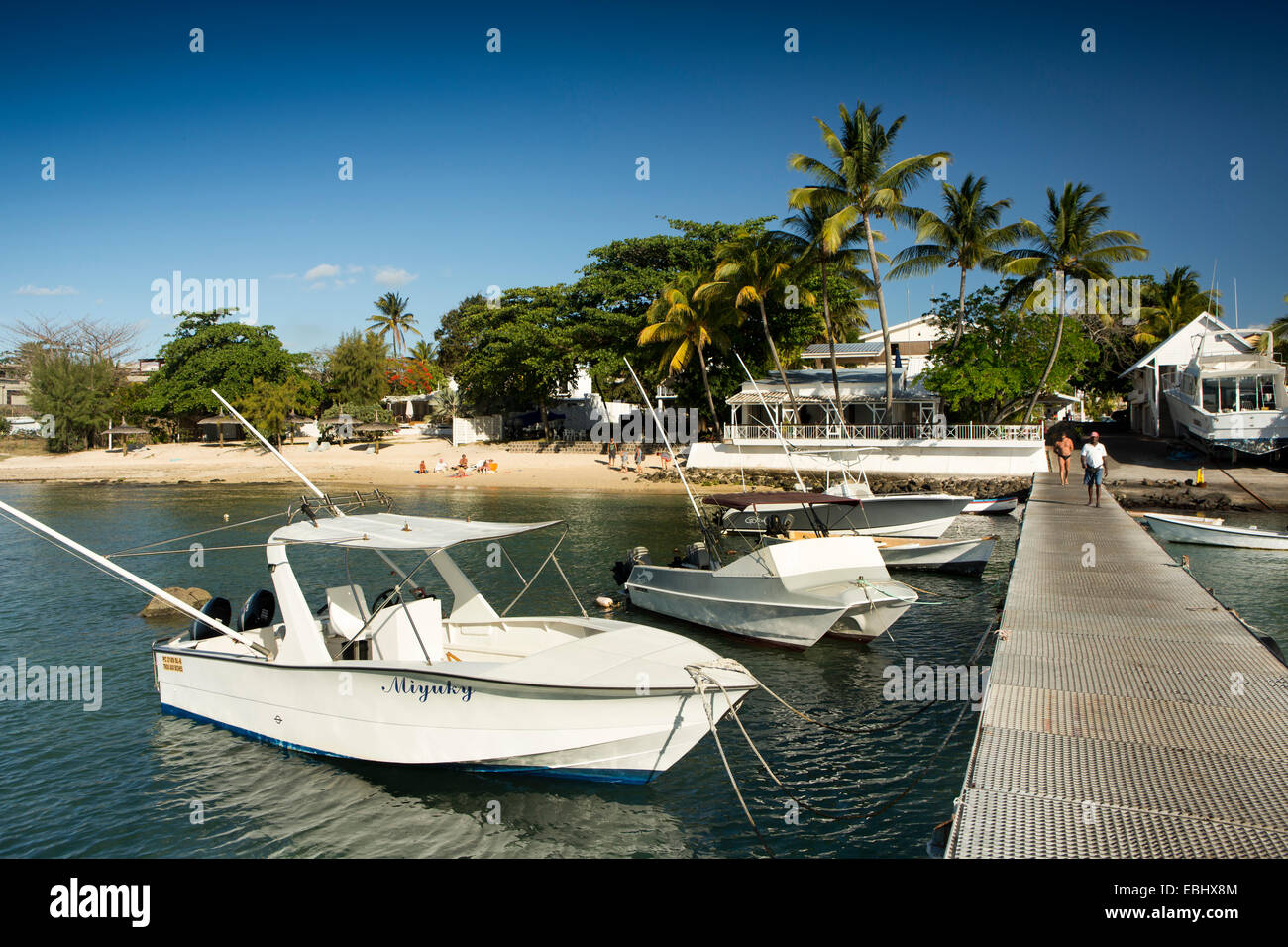 Mauritius, Trou aux Biches, leisure boat moored off public beach Stock