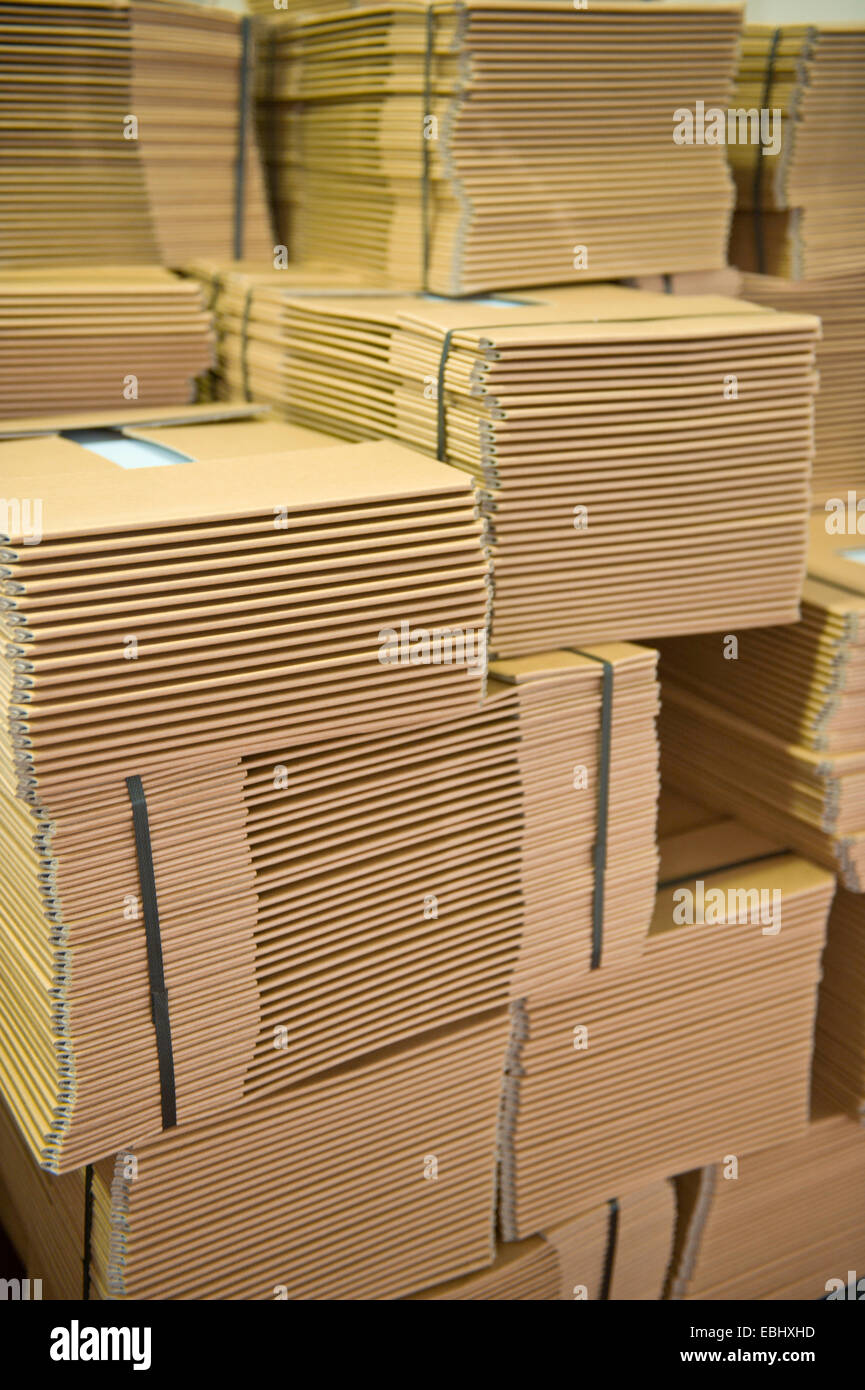 Piles of cardboard storage boxes ready for dispatch Stock Photo