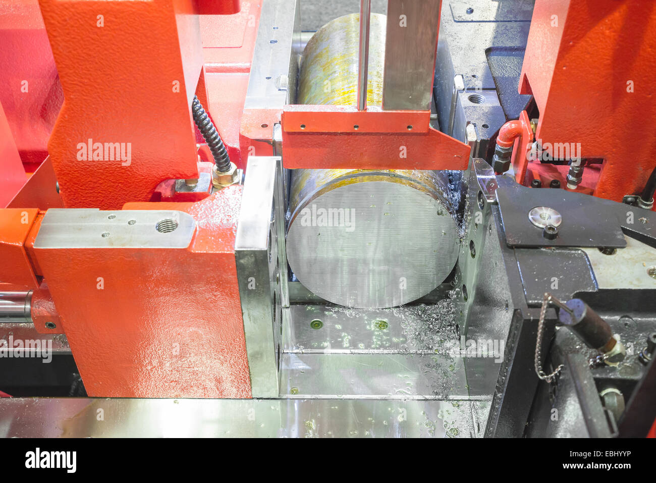 Close up steel band saw machine working in factory Stock Photo