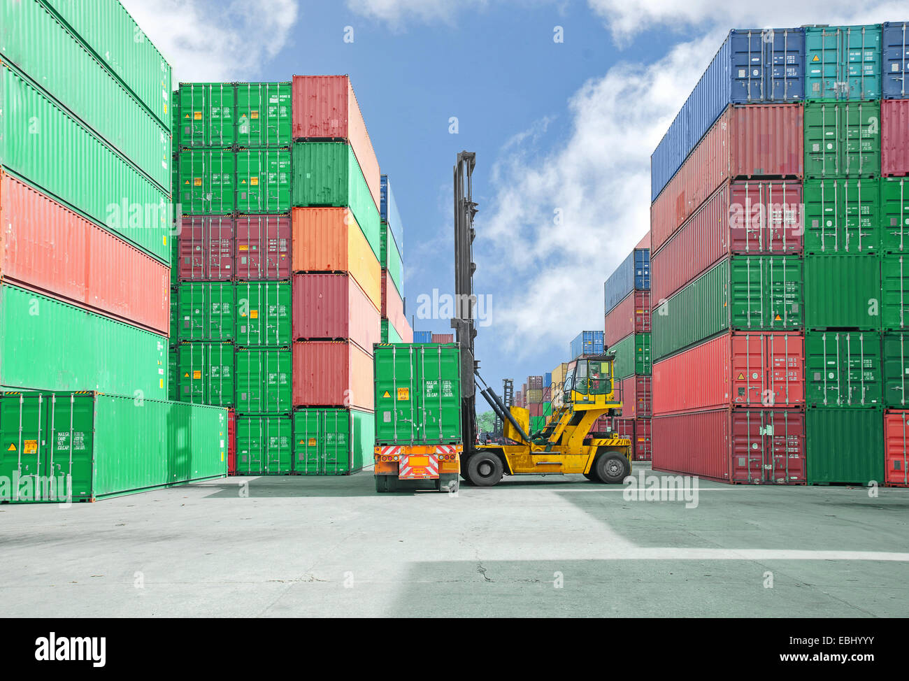 Crane lifter handling container box loading to truck Stock Photo