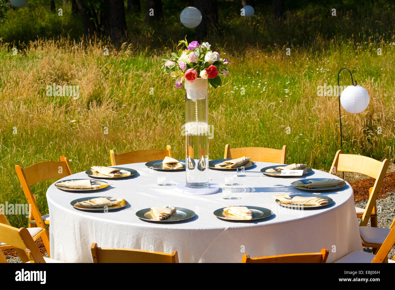 Dining Table At A Wedding Reception Outdoors With Plates And Stock