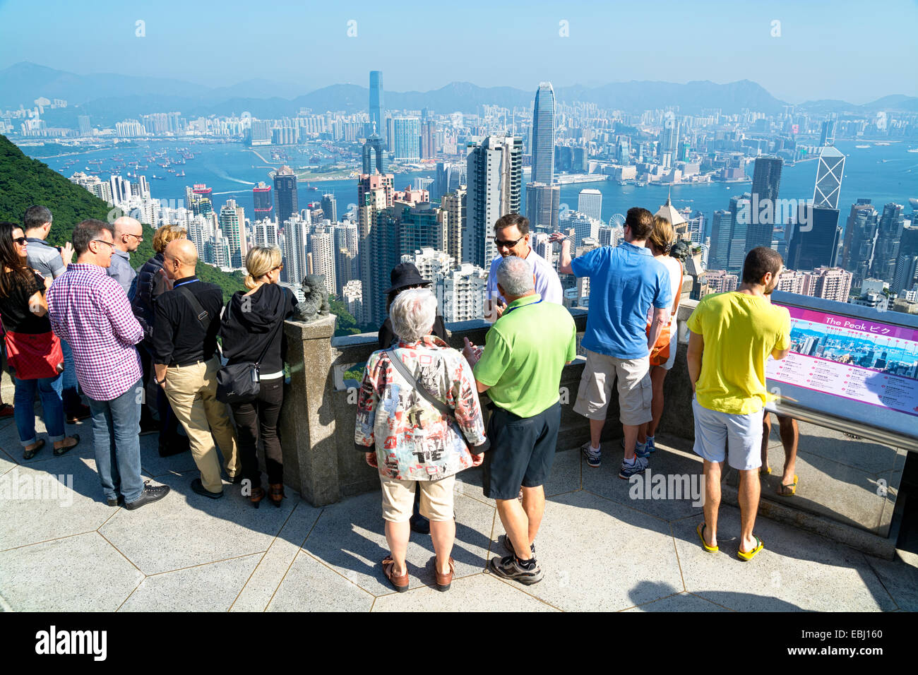 Hong Kong, Hong Kong SAR -November 15, 2014: Tourists at Victoria Peak in Hong Kong. Victoria Peak is one of the most popular sp Stock Photo