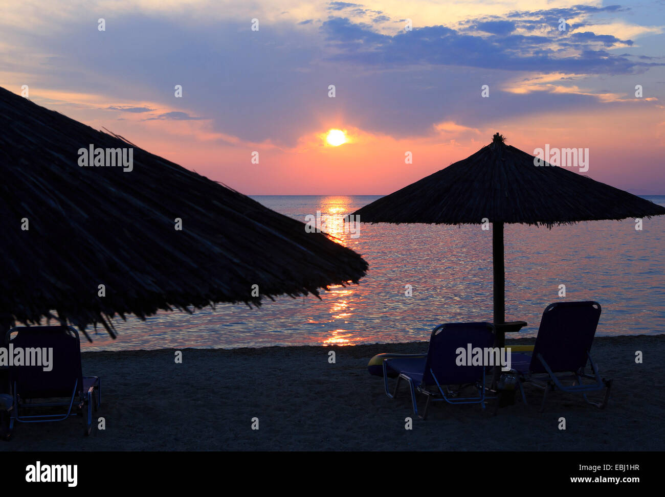 Sunset on beach Stock Photo - Alamy