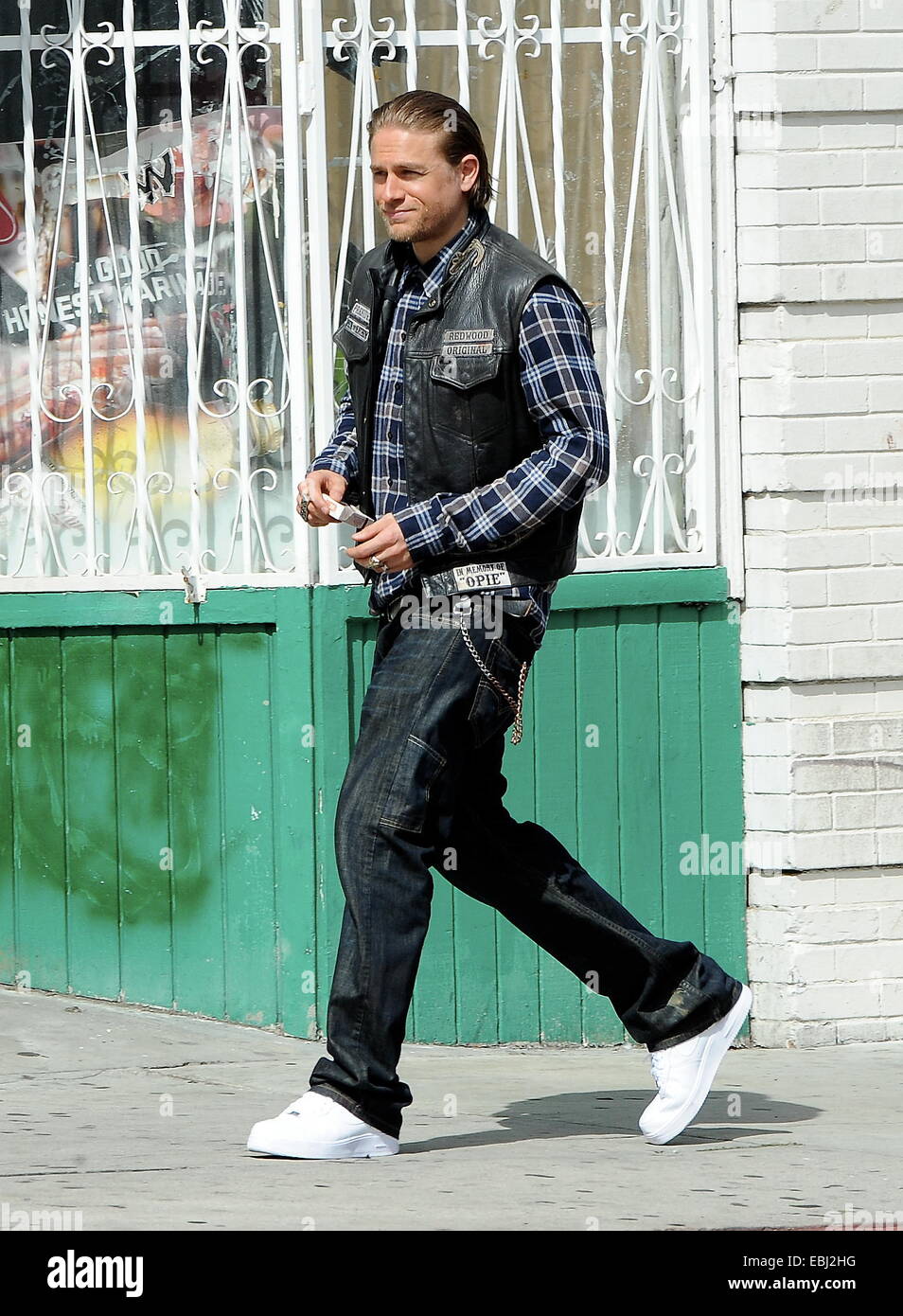 Charlie Hunnam hops on his bike on the set of 'Sons Of Anarchy' after taking time off to film his new movie Crimson Peak in Canada. The uk actor was seen fooling around with the rest of the cast as they film the last season to their hit biker show.  Featu Stock Photo