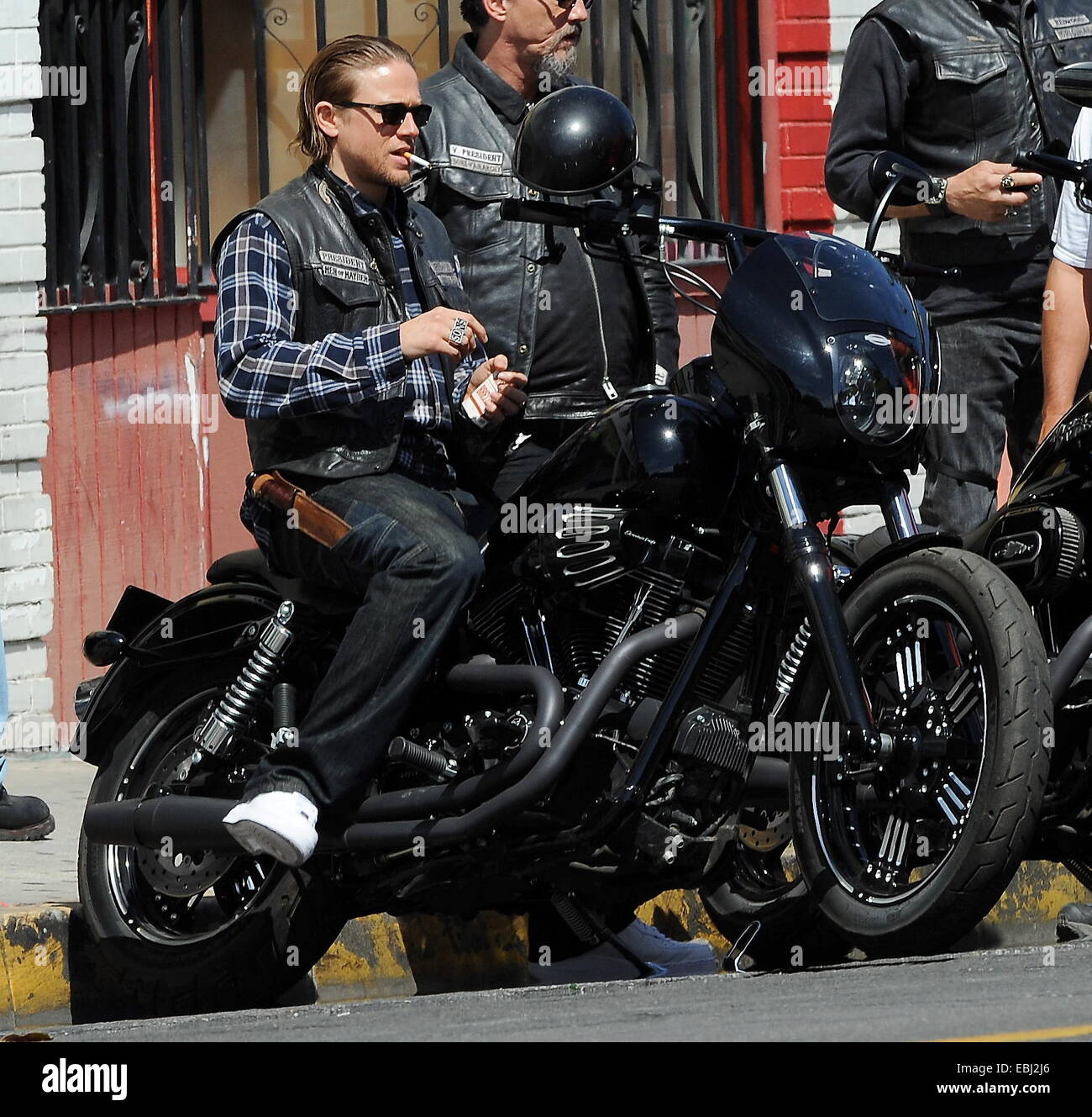 Charlie Hunnam hops on his bike on the set of 'Sons Of Anarchy' after taking time off to film his new movie Crimson Peak in Canada. The uk actor was seen fooling around with the rest of the cast as they film the last season to their hit biker show.  Featu Stock Photo