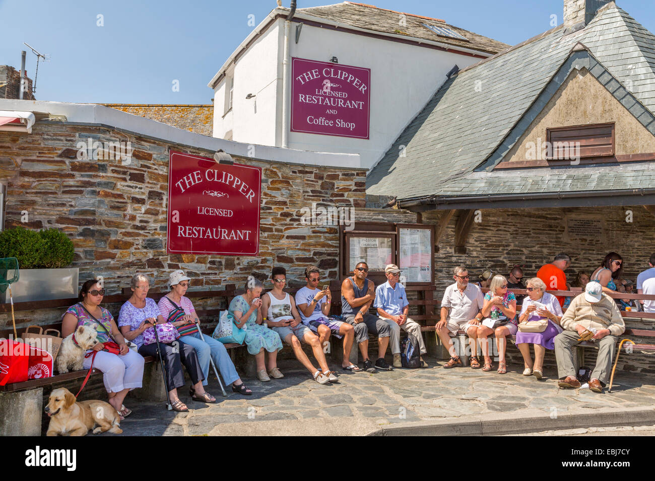 Holidaymakers relaxing and enjoying the sunshine in Padsow Cornwall Stock Photo