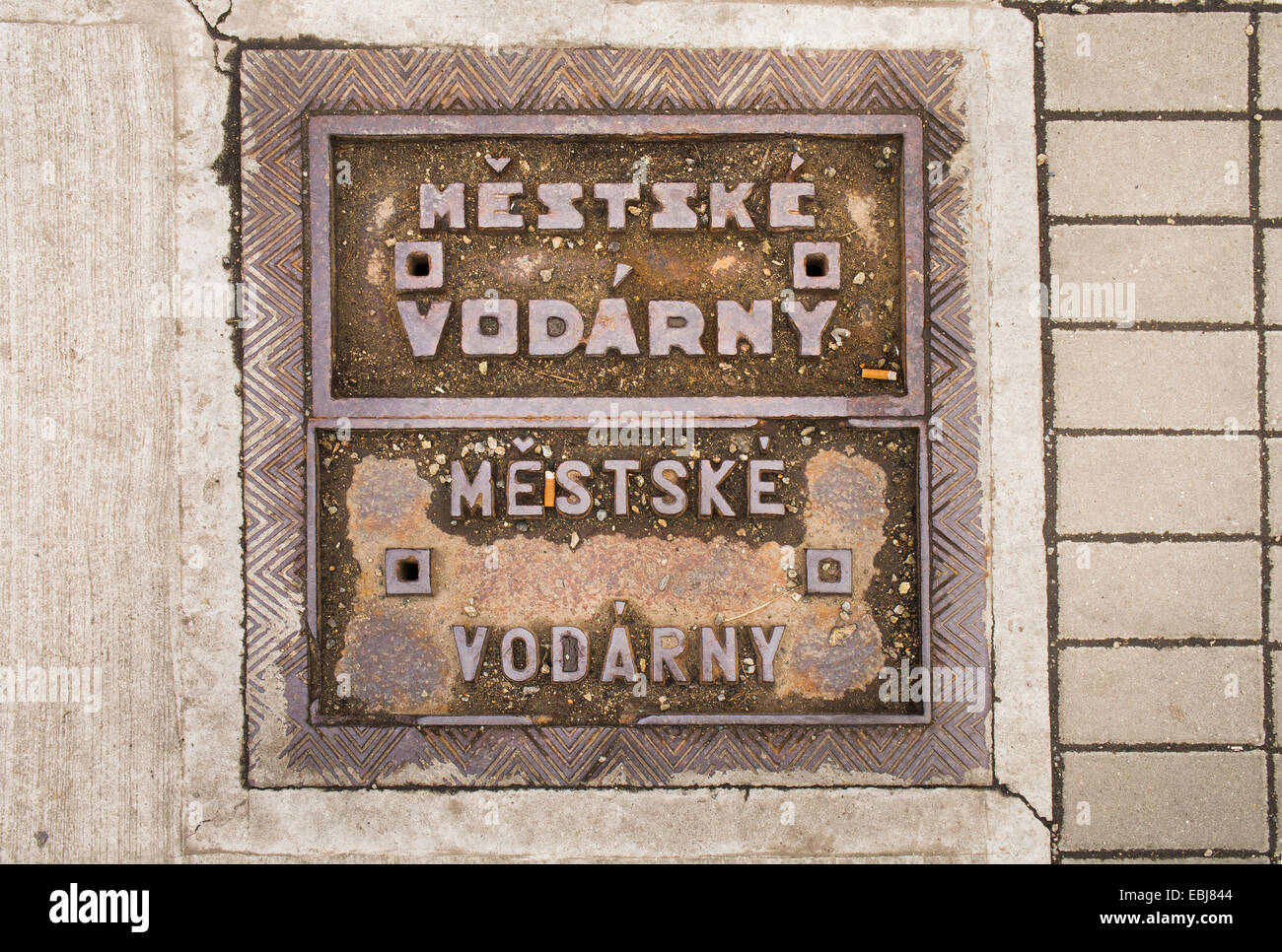 street, sewer lid on a street, MUNICIPAL WATER SUPPLY SYSTEM Stock Photo