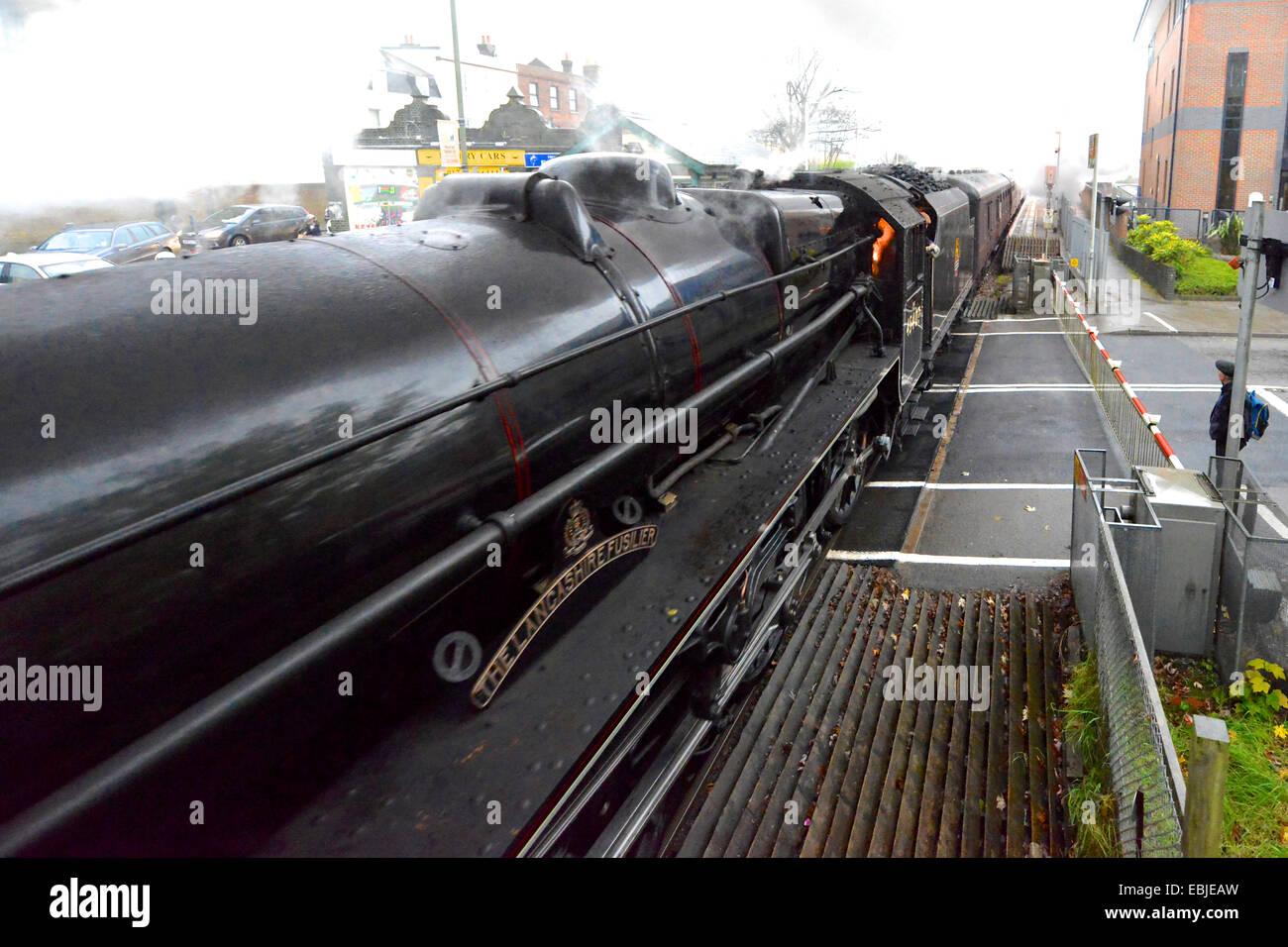 Reigate, Surrey, UK. 2nd December, 2014. 0858 hrs Tuesday 2nd December 2014. The “Cathedrals Express” train, comprising of two of only 18 surviving “Black 5” locomotives: LMT Class 5MT 4-6-0 numbers 44871 Stanier Class “Black Five” and the 45407 Stanier Class “Black Five”, badged “The Lancashire Fusilier” Steam Locomotives together haul passengers at speed through the Surrey Hills at Reigate in Surrey, 0858 hrs Tuesday 2nd December 2014 en route to Bath Spa and Bristol Temple Meads. Credit:  Photo by Lindsay Constable/Alamy Live News Stock Photo