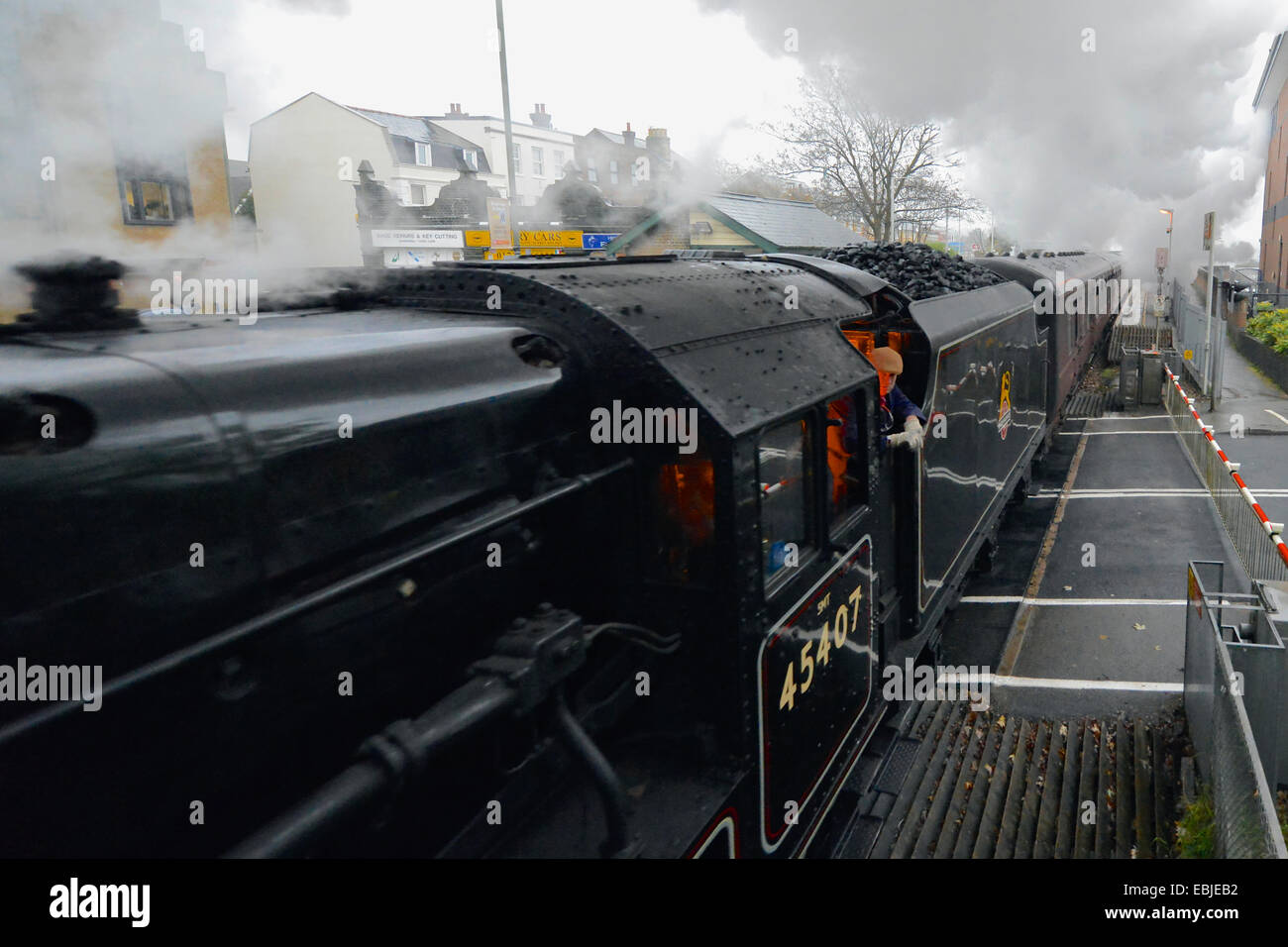 UK Reigate, Surrey. 0858 hrs Tuesday 2nd December 2014. The “Cathedrals Express” train, comprising of two of only 18 surviving “Black 5” locomotives: LMT Class 5MT 4-6-0 numbers 44871 Stanier Class “Black Five” and the 45407 Stanier Class “Black Five”, badged “The Lancashire Fusilier” Steam Locomotives together haul passengers at speed through the Surrey Hills at Reigate in Surrey, 0858 hrs Tuesday 2nd December 2014 en route to Bath Spa and Bristol Temple Meads. Credit:  Photo by Lindsay Constable/Alamy Live News Stock Photo