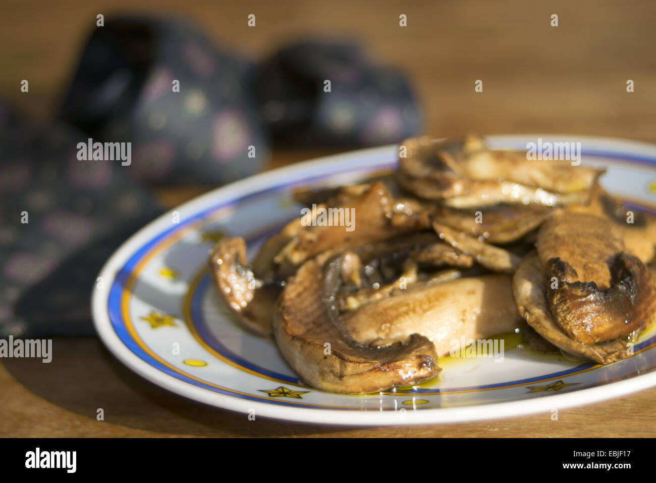 italian diet and recipes: roast champignon mushrooms Stock Photo