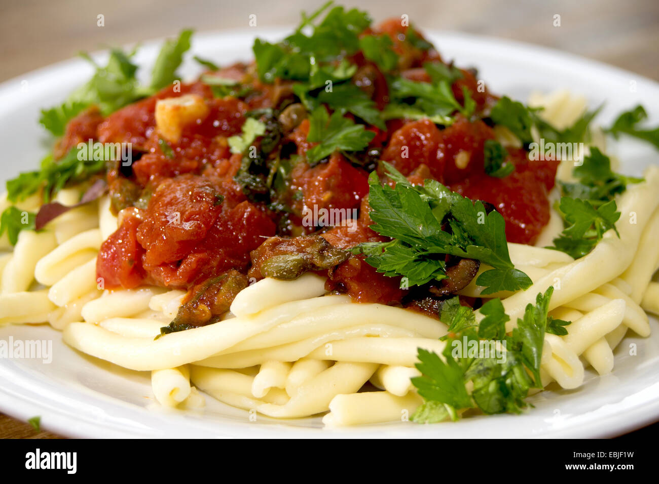 traditional and typical roman dish: pasta alla puttanesca Stock Photo