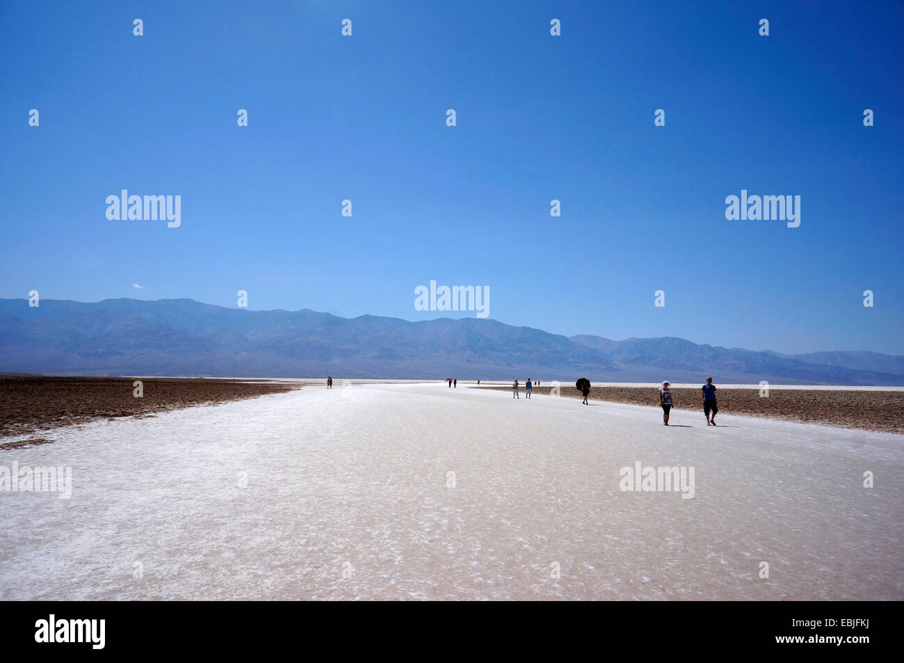 tourists walking on the salt lake, USA, California, Death-Valley-Nationalpark, Badwater Stock Photo