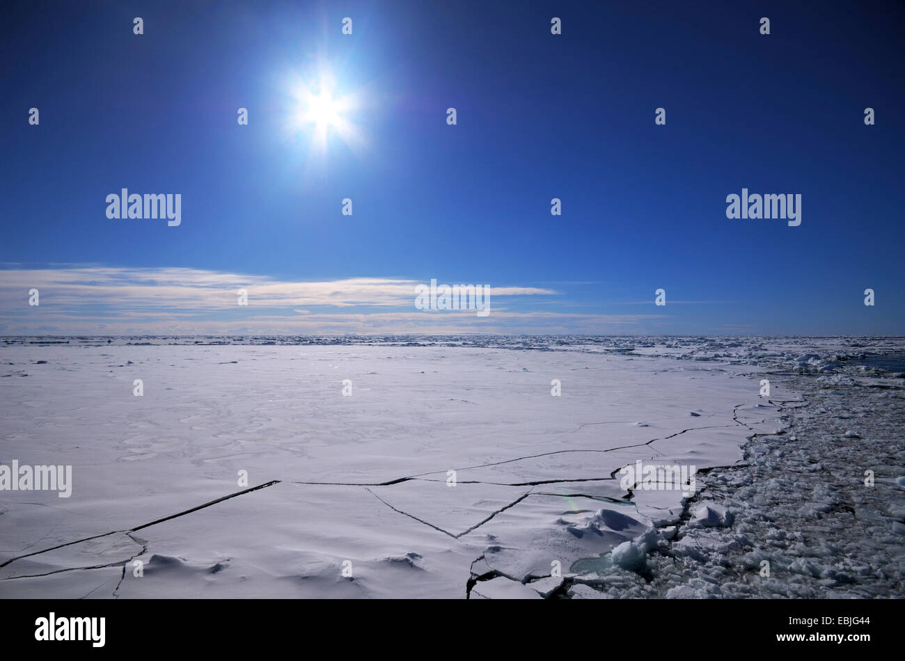 Sun over the breaking ice cover of the South Polar Ocean , Antarctica Stock Photo