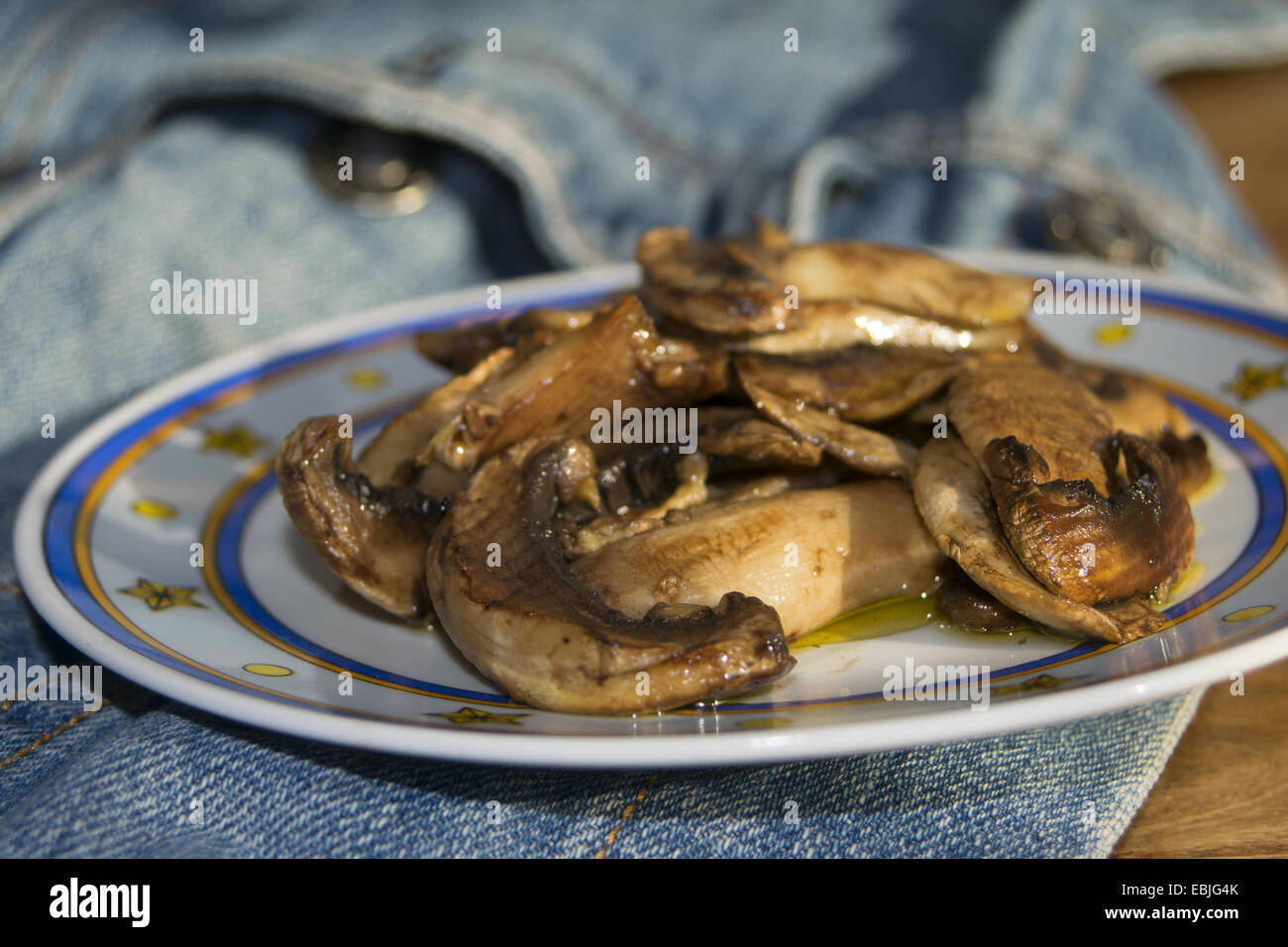 italian diet and recipes: roast champignon mushrooms Stock Photo