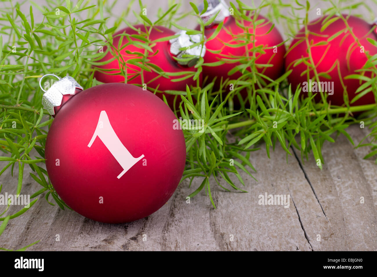 Four red christmas balls with digit one Stock Photo
