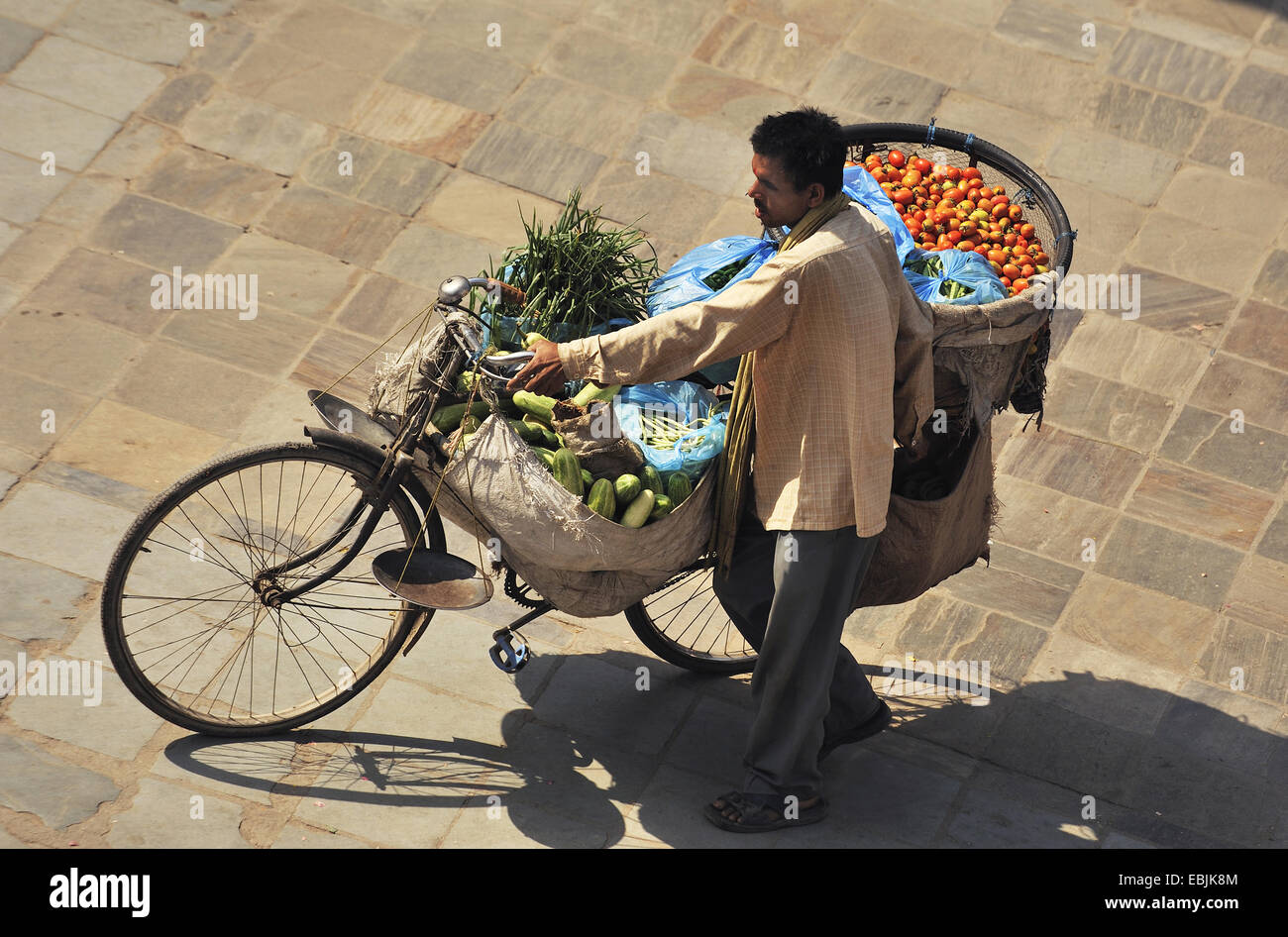 fruits and vegetables for sale in bags and a basket on bike, Nepal, Kathmandu Stock Photo