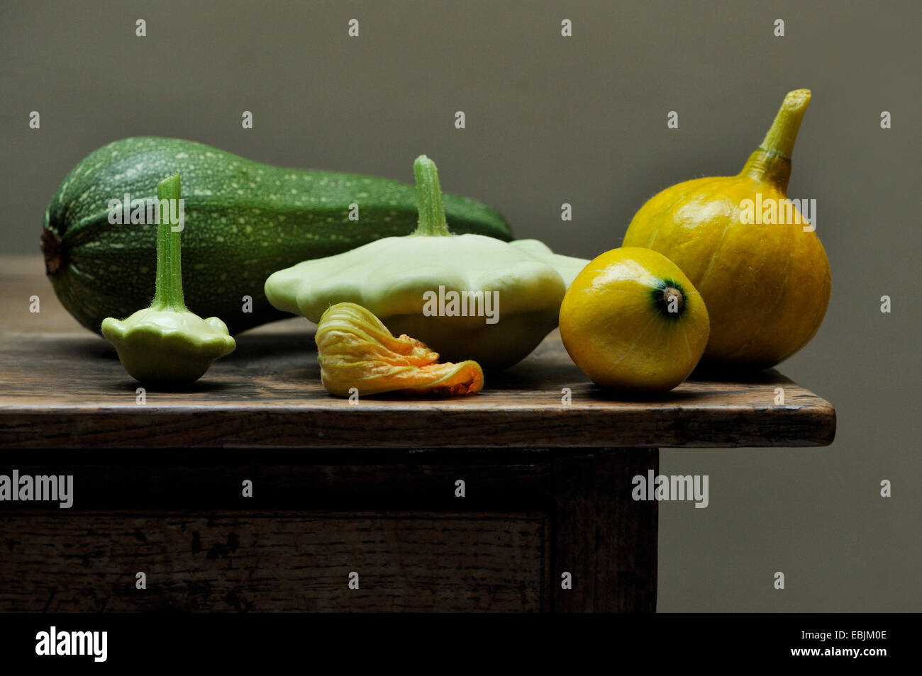 Still life of vegetables including marrow, courgette flower and gourds Stock Photo Alamy