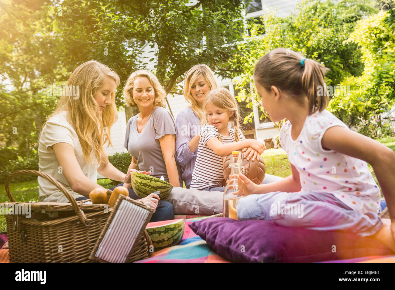 Family having picnic on grass hi-res stock photography and images - Alamy