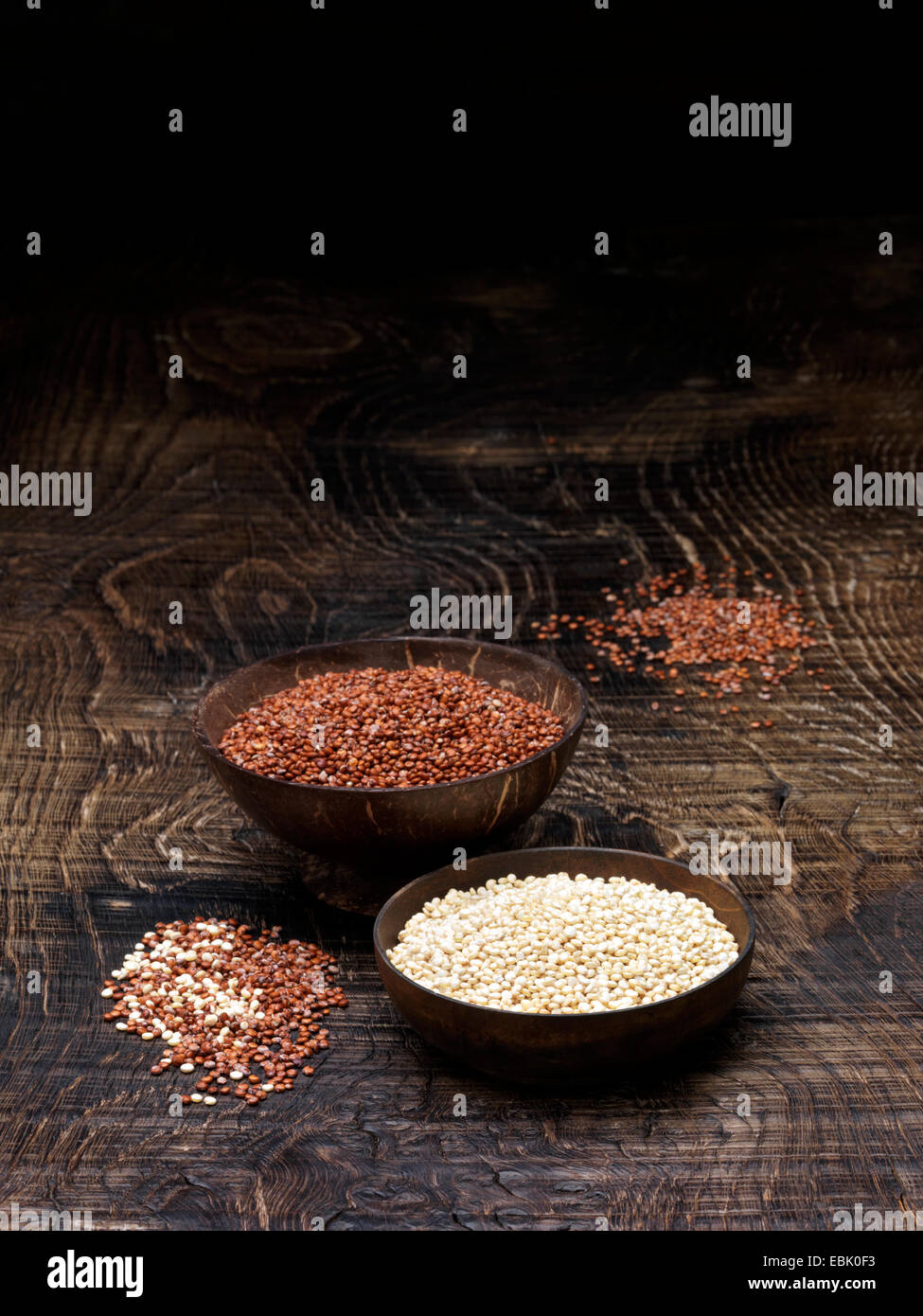 Still life with bowls of red quinoa and white quinoa seeds Stock Photo