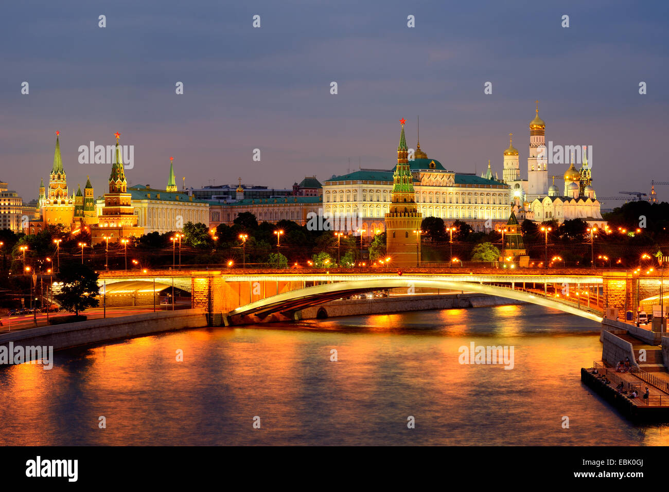 View of Kremlin towers and the Bolshoy Kamenny bridge over Moskva river at night, Moscow, Russia Stock Photo