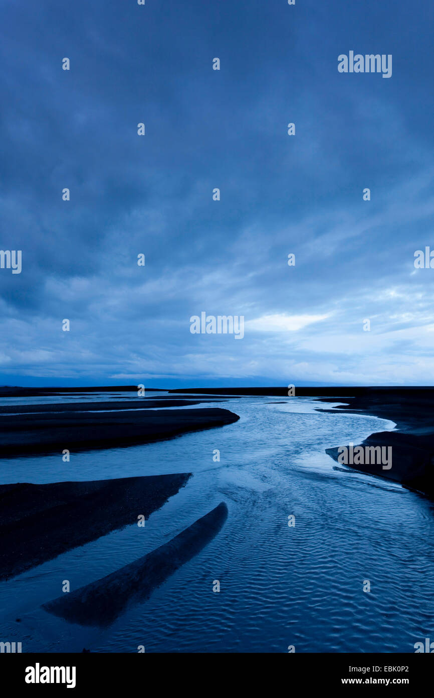 moody skies over glacial outflow river, Iceland, Skogar Stock Photo