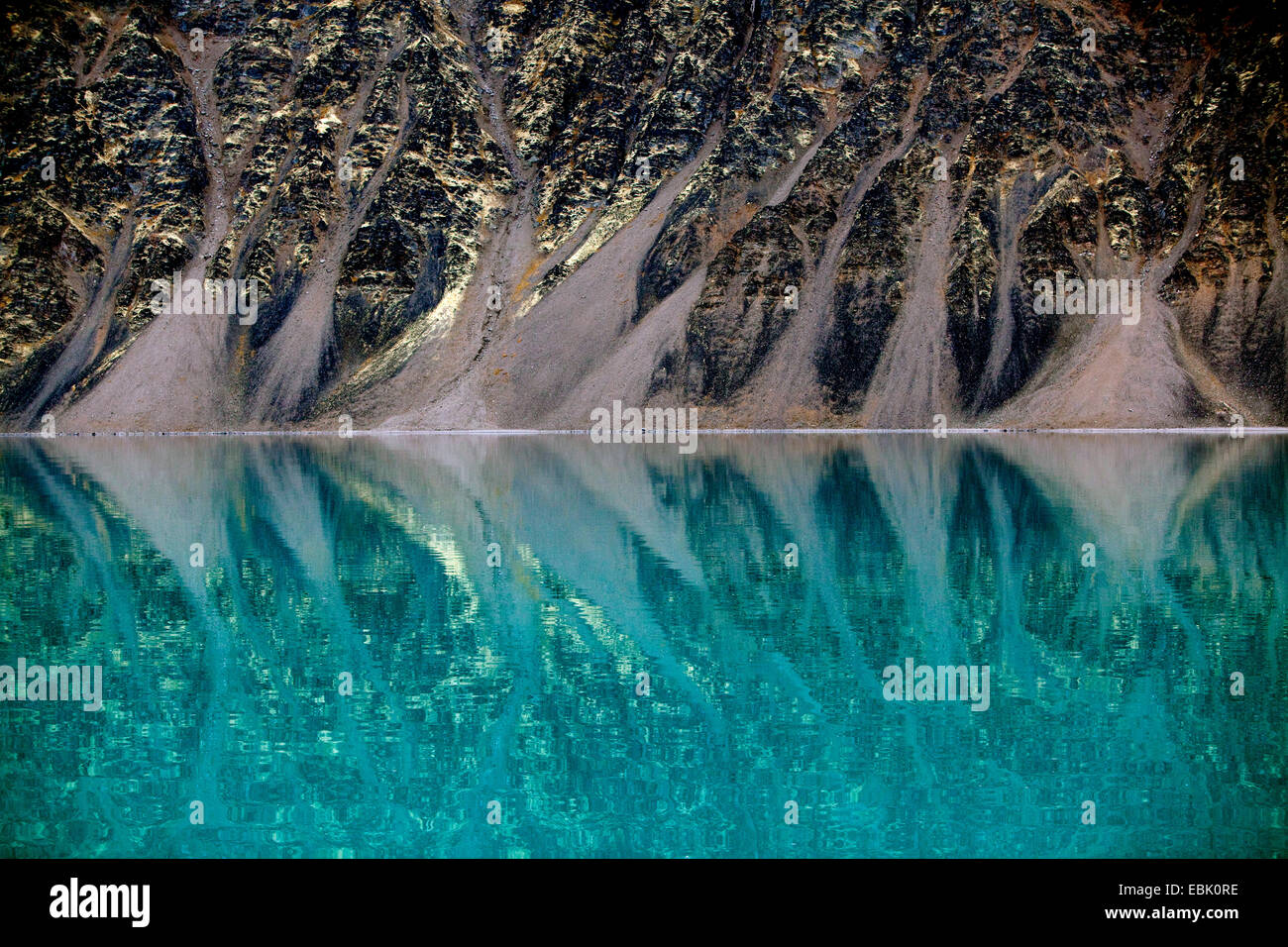 rocky coast mirroring in glacial fjord, Norway, Svalbard Inseln ...