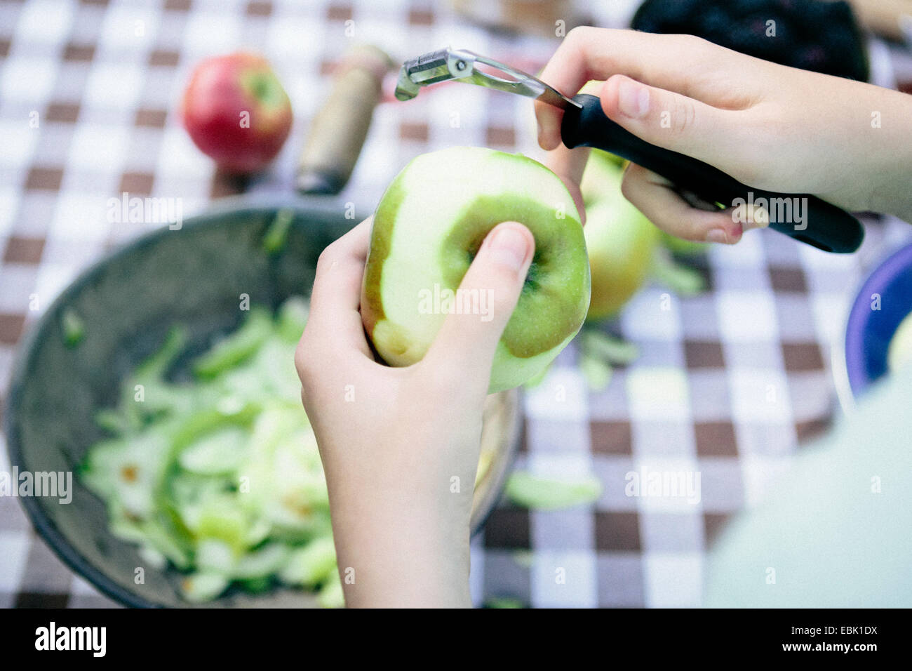 Person peeling apple Stock Photo