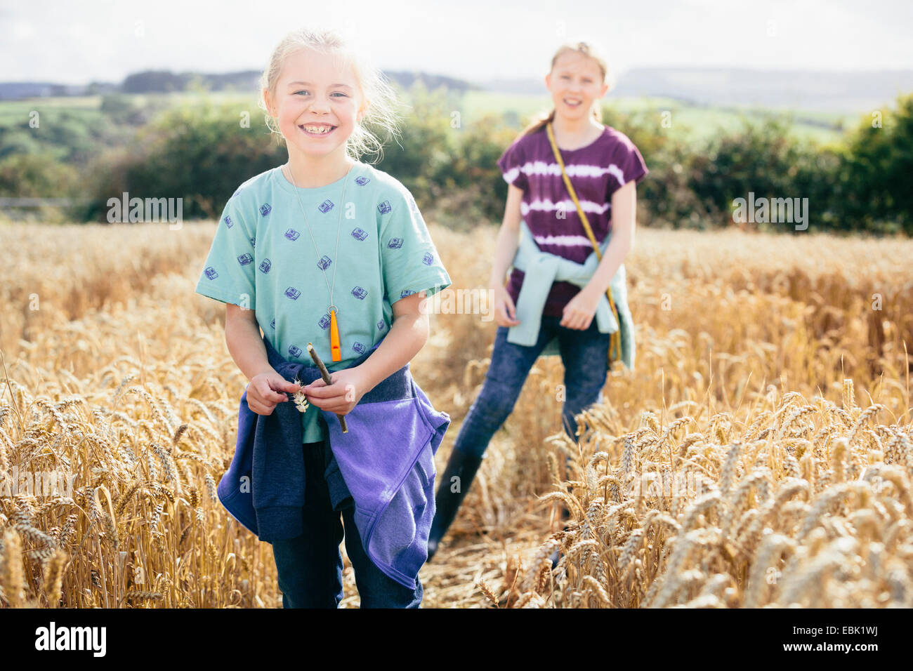 Two girls smiling at camera hi-res stock photography and images - Alamy