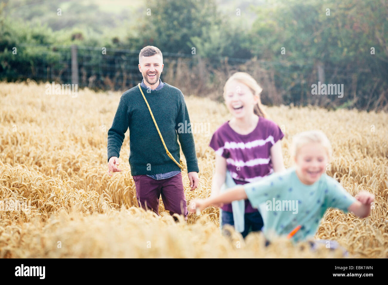 Two girls running through field hi-res stock photography and images - Alamy