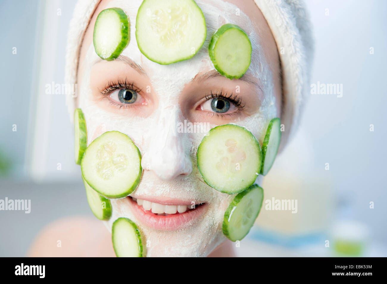 woman with cucumber face masque Stock Photo