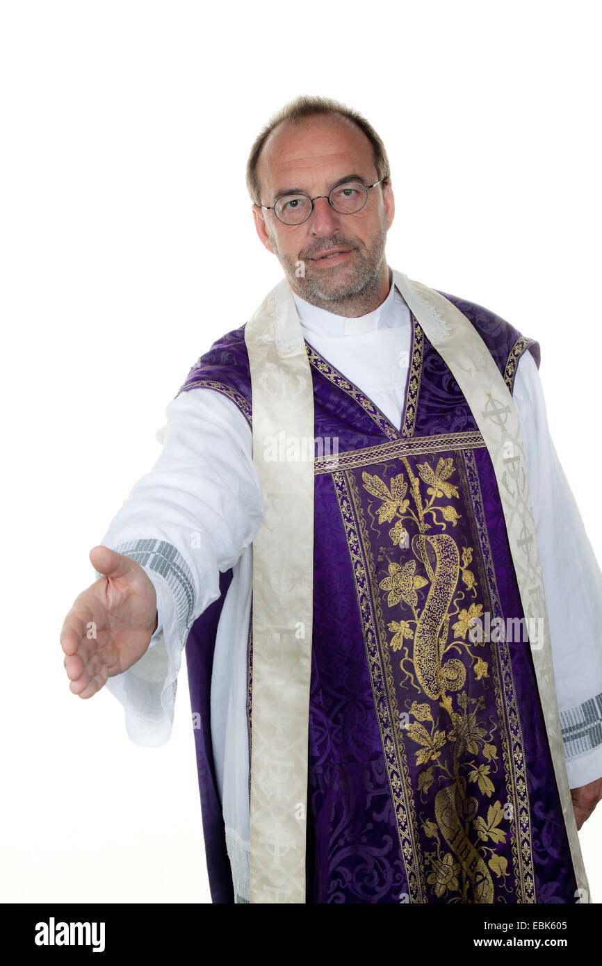 catholic priest offers a hand for greeting Stock Photo
