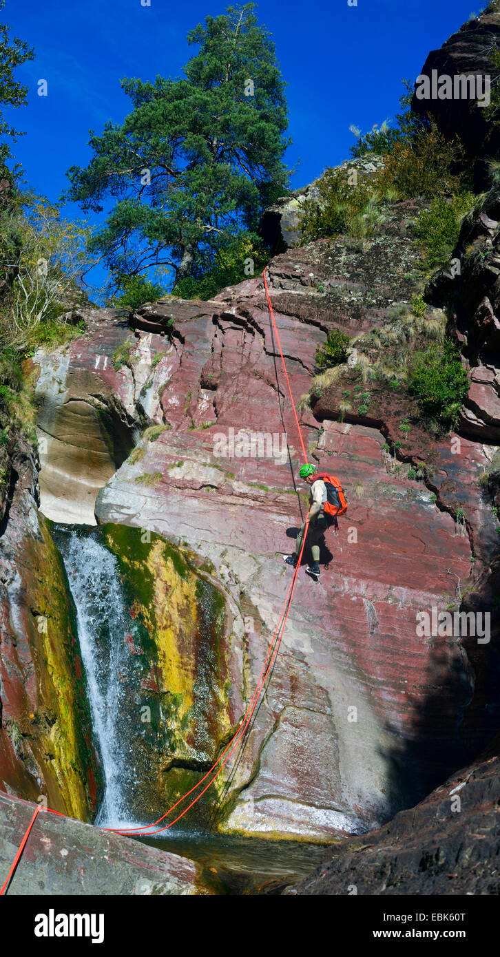 climber next waterfall at rock wall, France, Mercantour National Park, Challandre Stock Photo