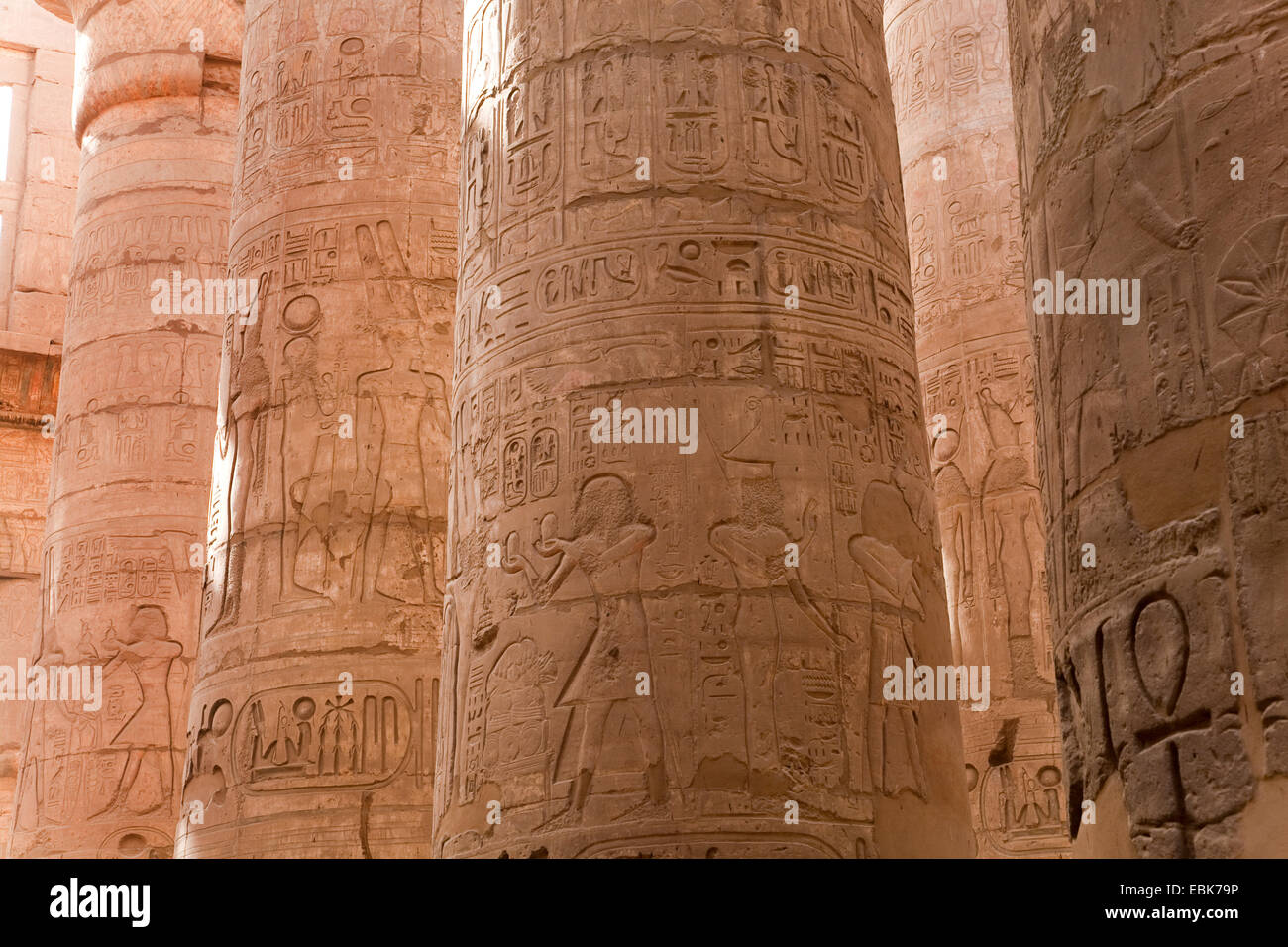 some of the 134 pillars onamented with reliefs in the great hall of the Precinct of Amun-Re, Egypt, Karnak, Luxor Stock Photo