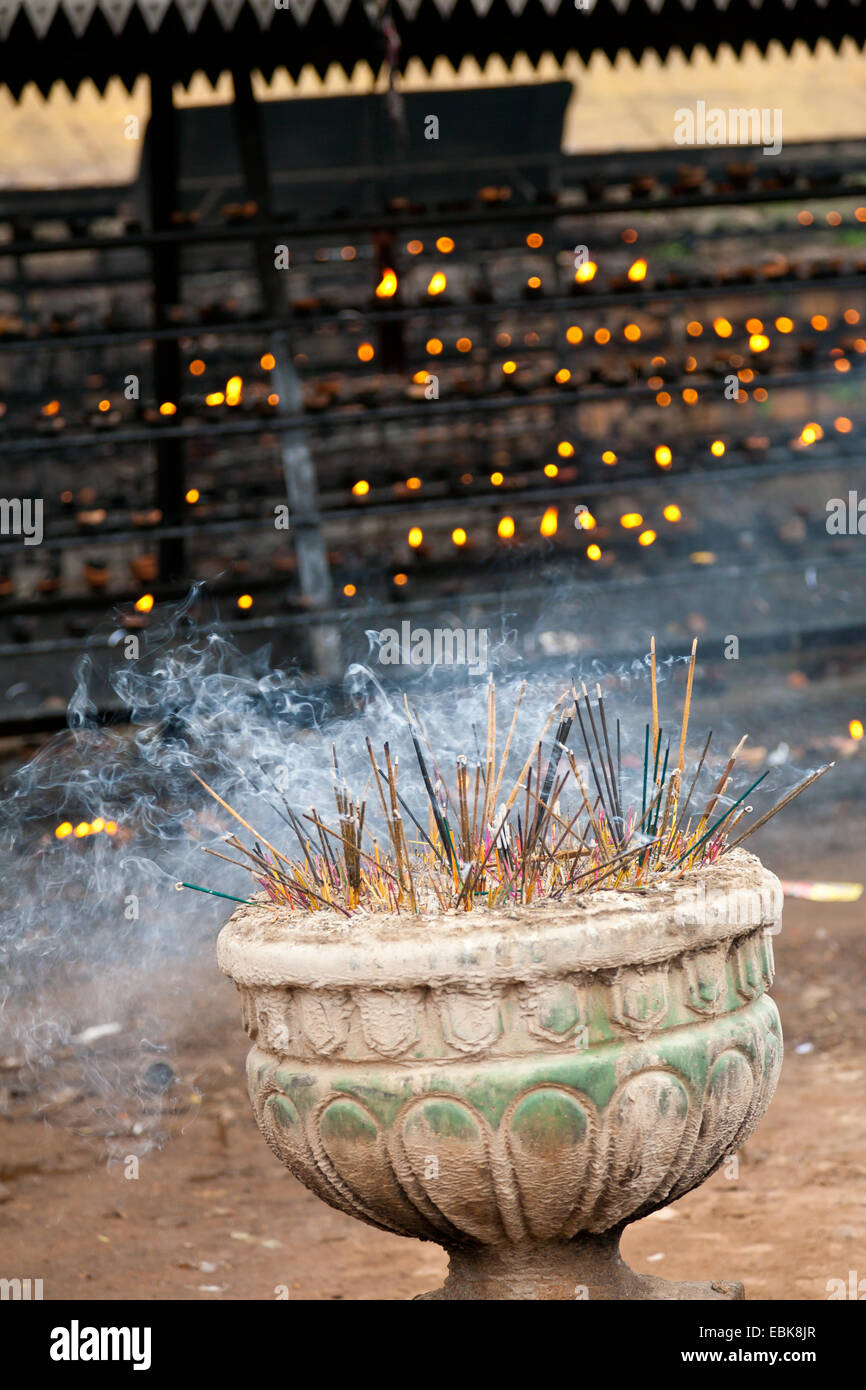 Burning incense sticks in a buddhist temple in Sri Lanka Stock Photo
